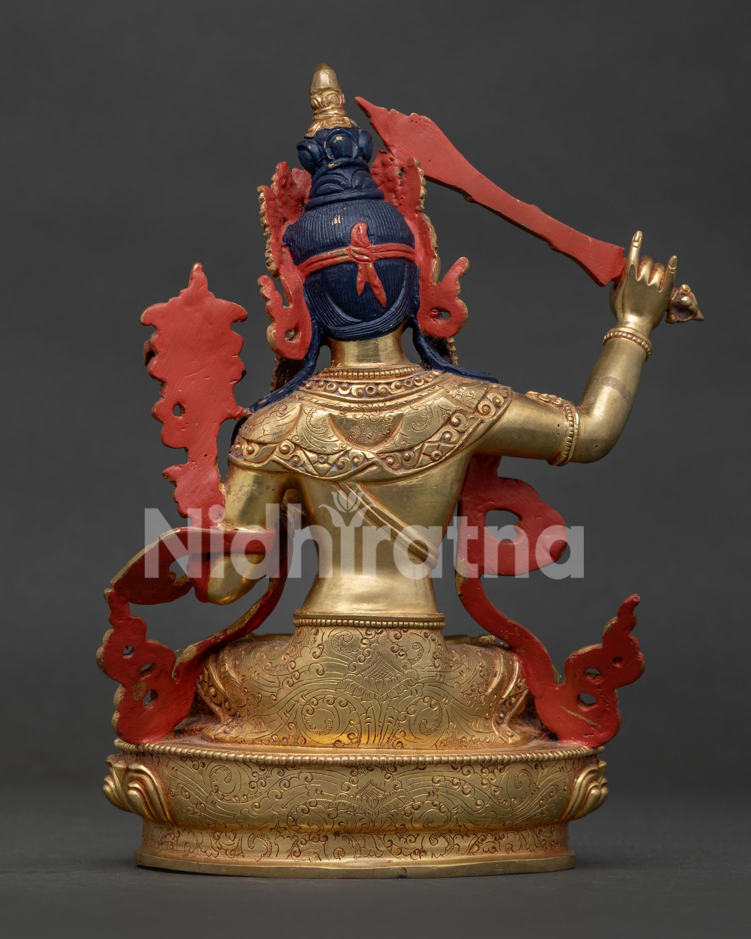 Back view of handcrafted Manjushri Statue showing lotus pedestal and copper finish