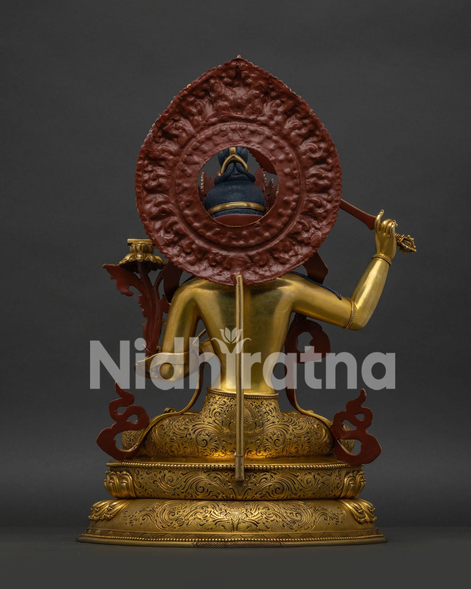 Back view of handcrafted Manjushri Statue with intricate copper repoussé detailing