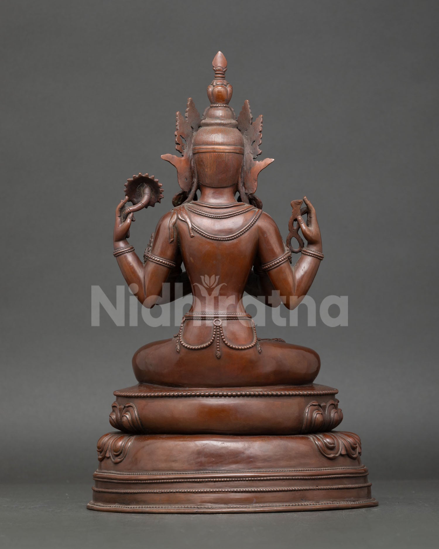 Back view of handcrafted Oxidized Copper Chenrezig Statue showing lost wax cast copper craftsmanship and lotus throne