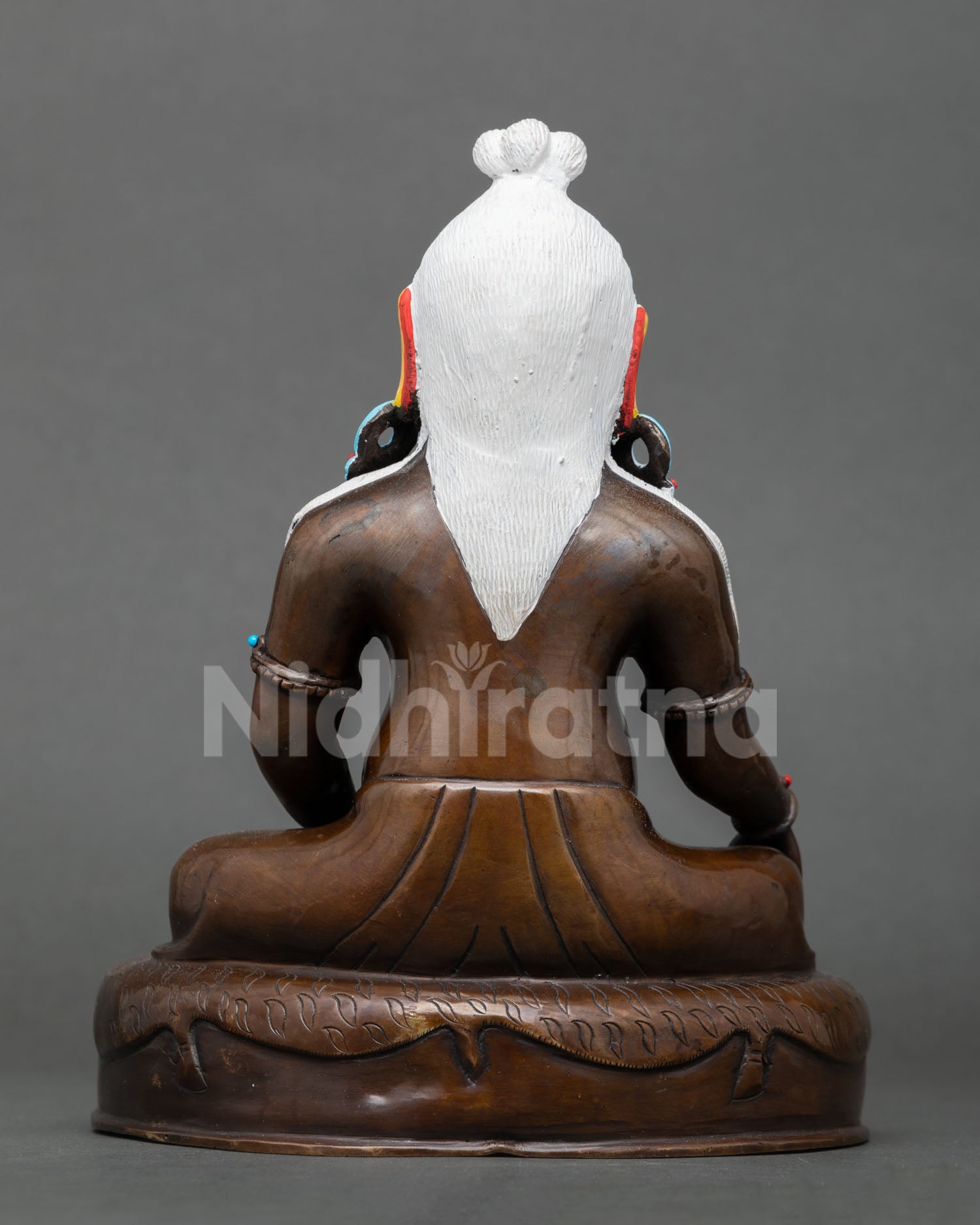 Back view of handcrafted Thangtong Gyalpo oxidized copper Buddhist sculpture