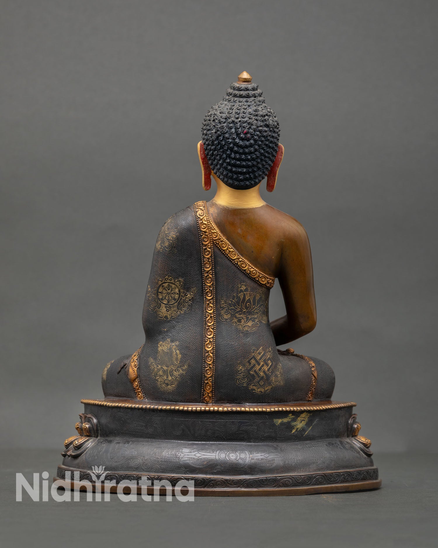 Back view of handmade Amitabha Buddha sculpture with ornate copper detailing oxidized finish lotus throne and spiritual altar decor presence