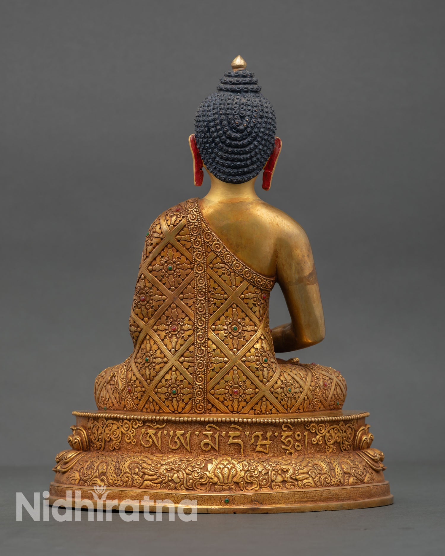 Back view of handmade Amitabha Buddha statue featuring fully bloomed lotus pedestal ornate copper detailing and radiant gold gilded spiritual Buddhist design