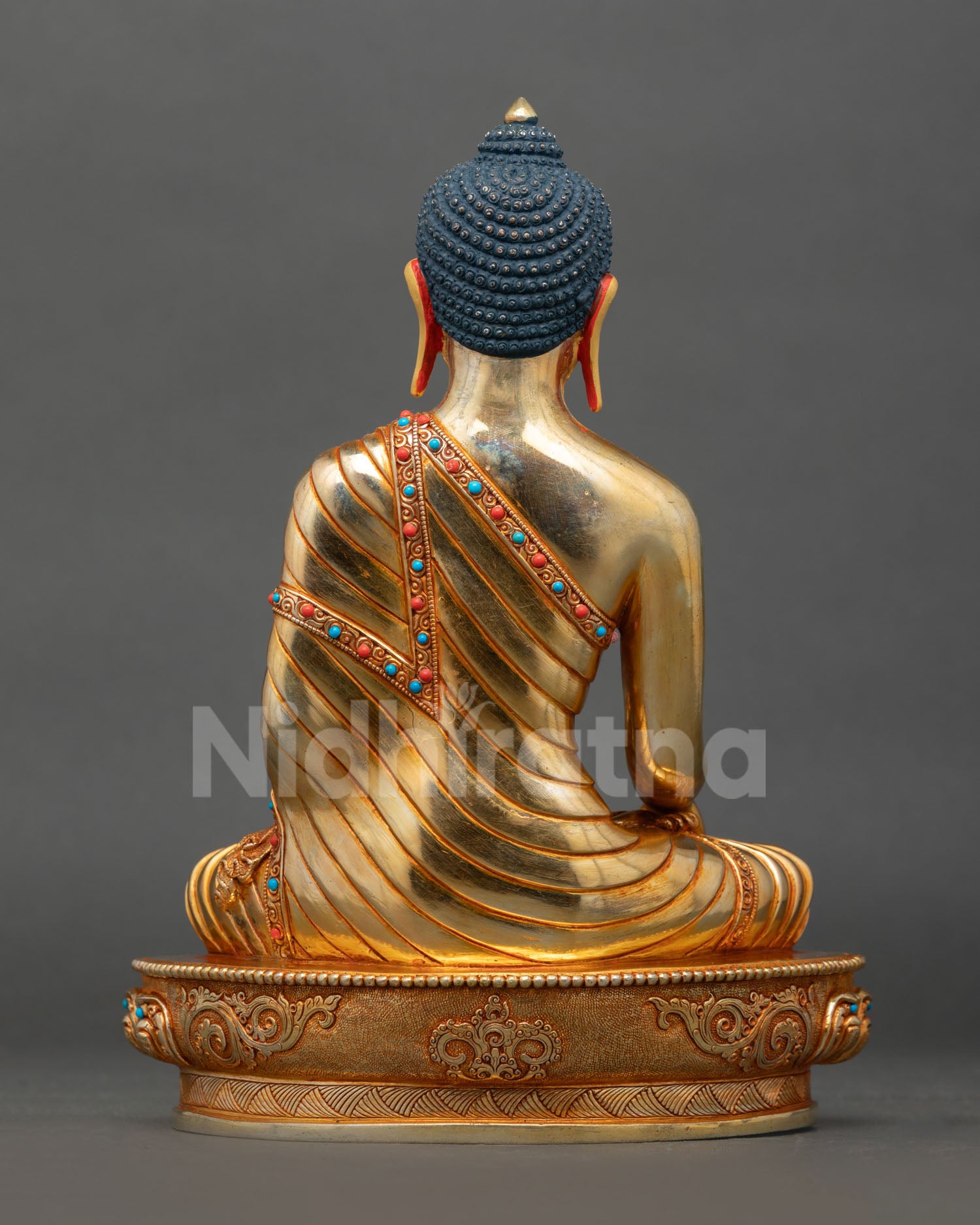 Back view of a handmade Buddha Shakyamuni statue showcasing traditional Nepalese Buddhist craftsmanship