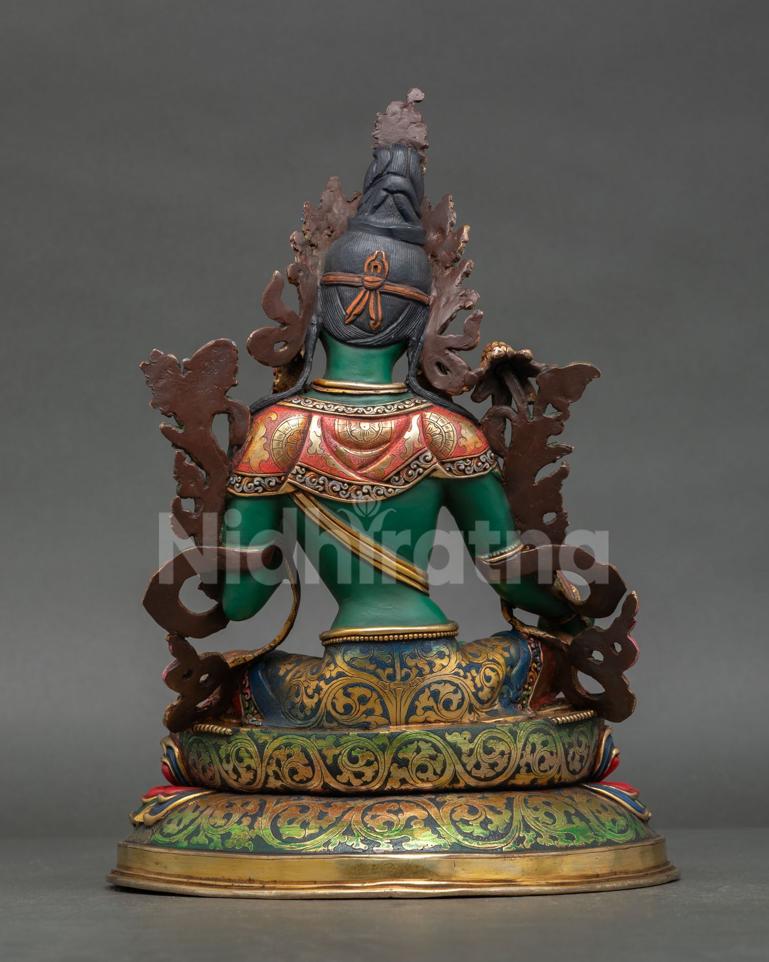 Back view of handmade Green Tara statue, crafted from copper with intricate Nepalese Buddhist artistry and sacred ornamentation.