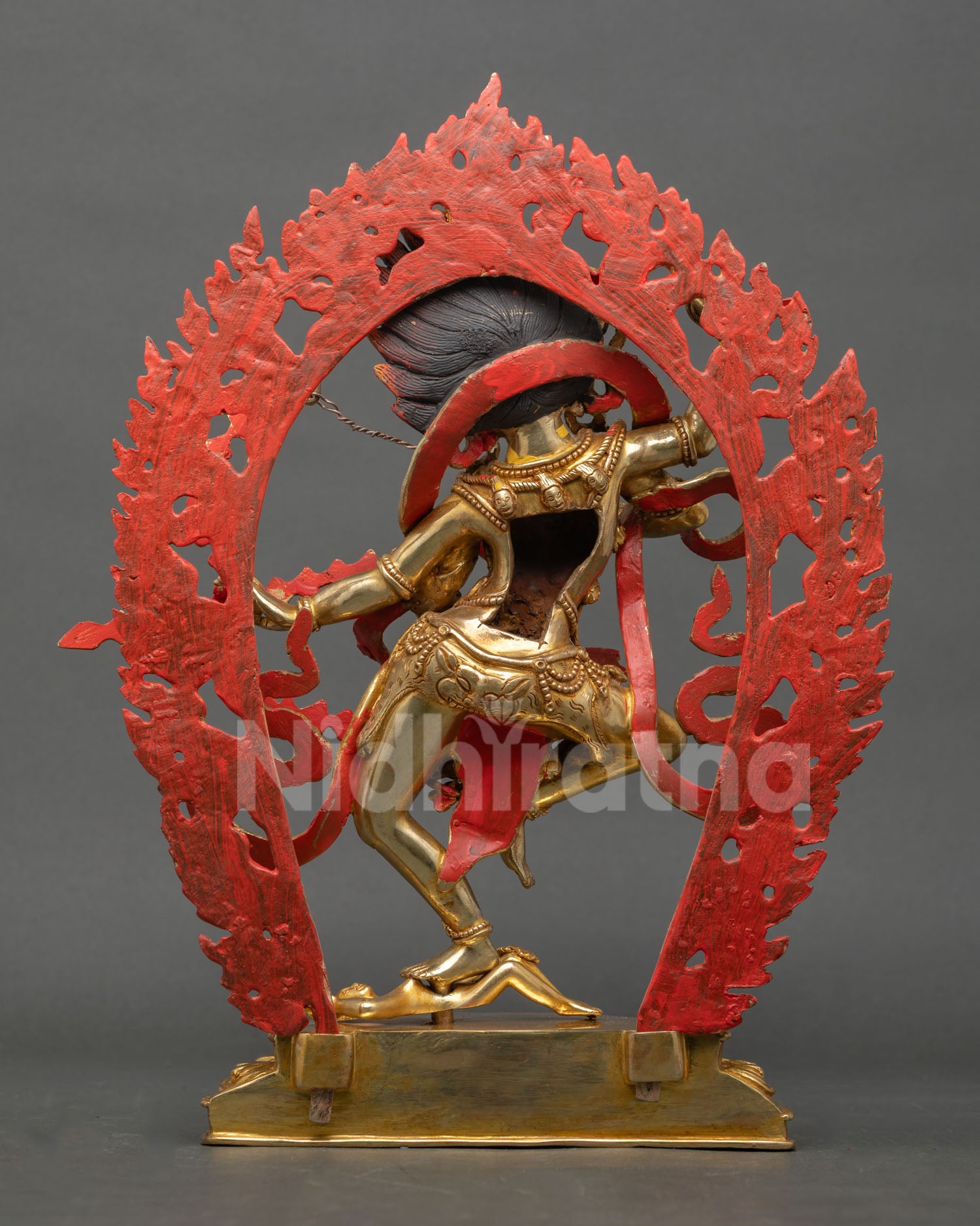 Back view of handmade Kurukulla statue from Nepal with copper body gold gilded finish and traditional Newari lost wax casting craftsmanship