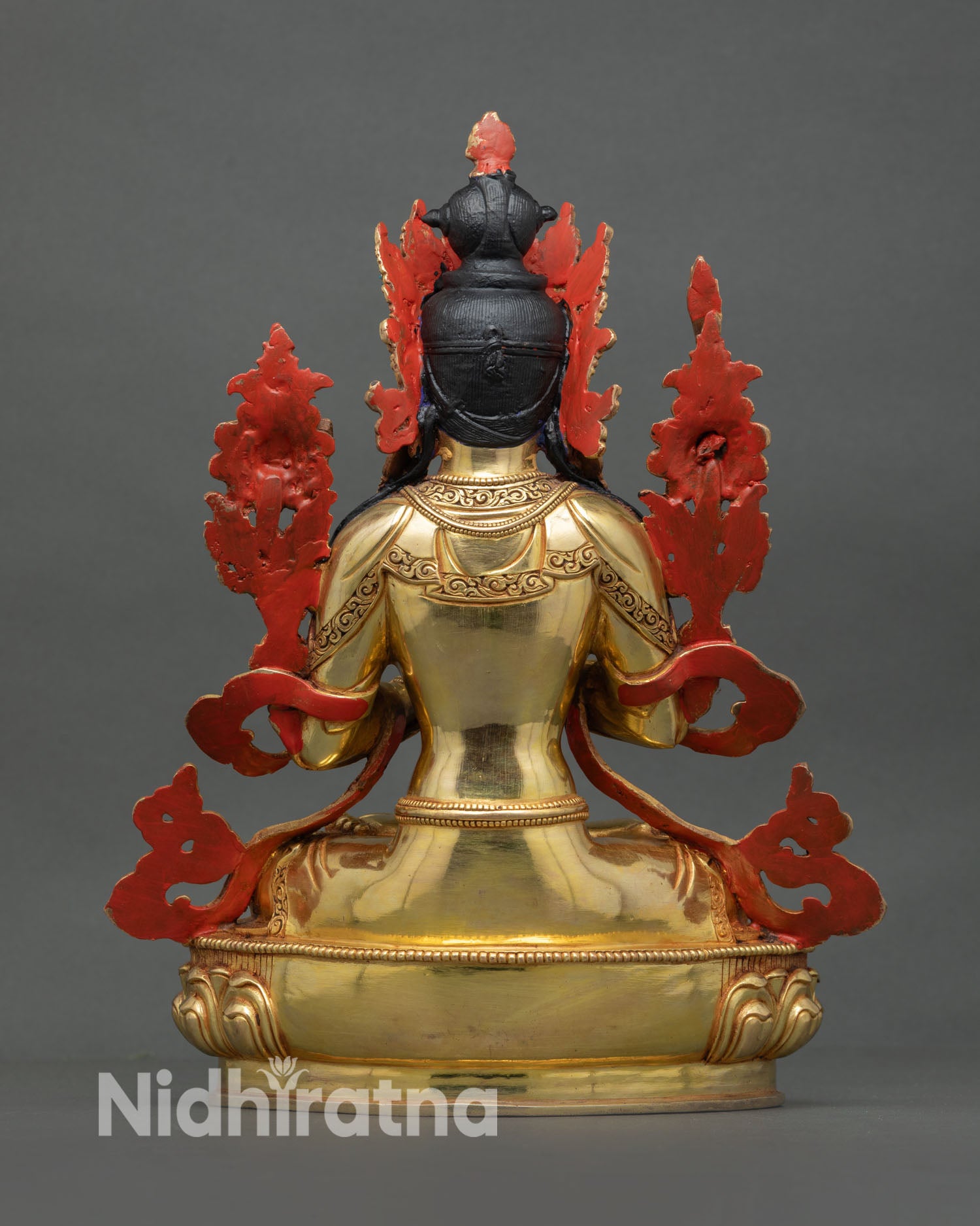 Back view of handmade Nepal Manjushree Statue with ornate copper carving and lotus base