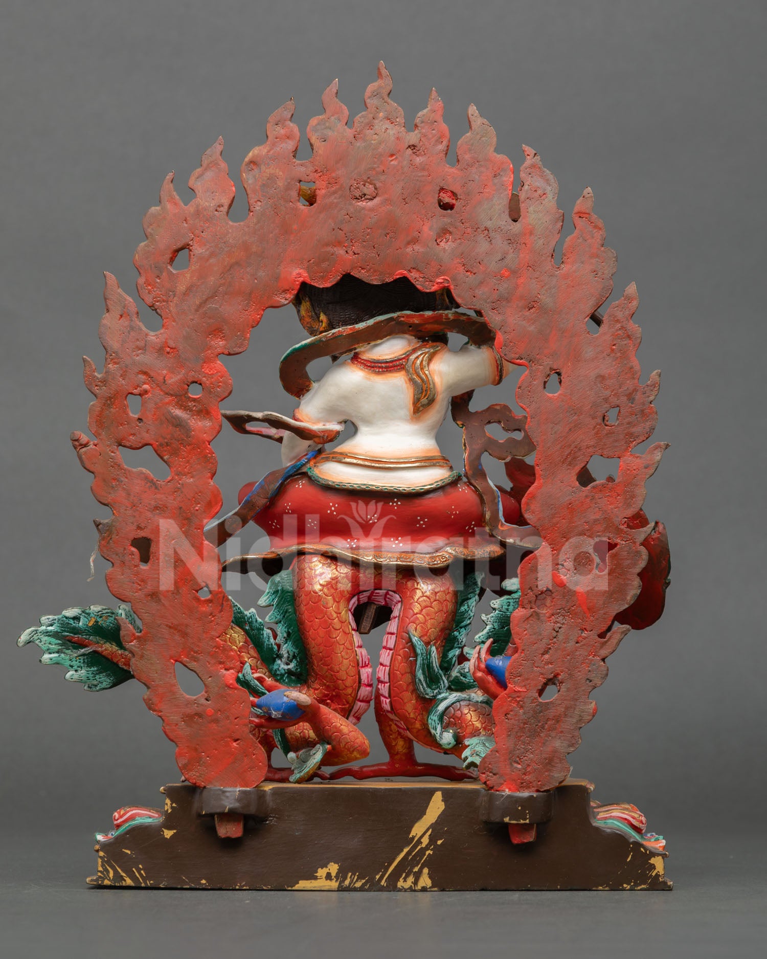 Back view of a handmade White Dzambhala statue showcasing traditional Newari craftsmanship and Himalayan Buddhist artistry