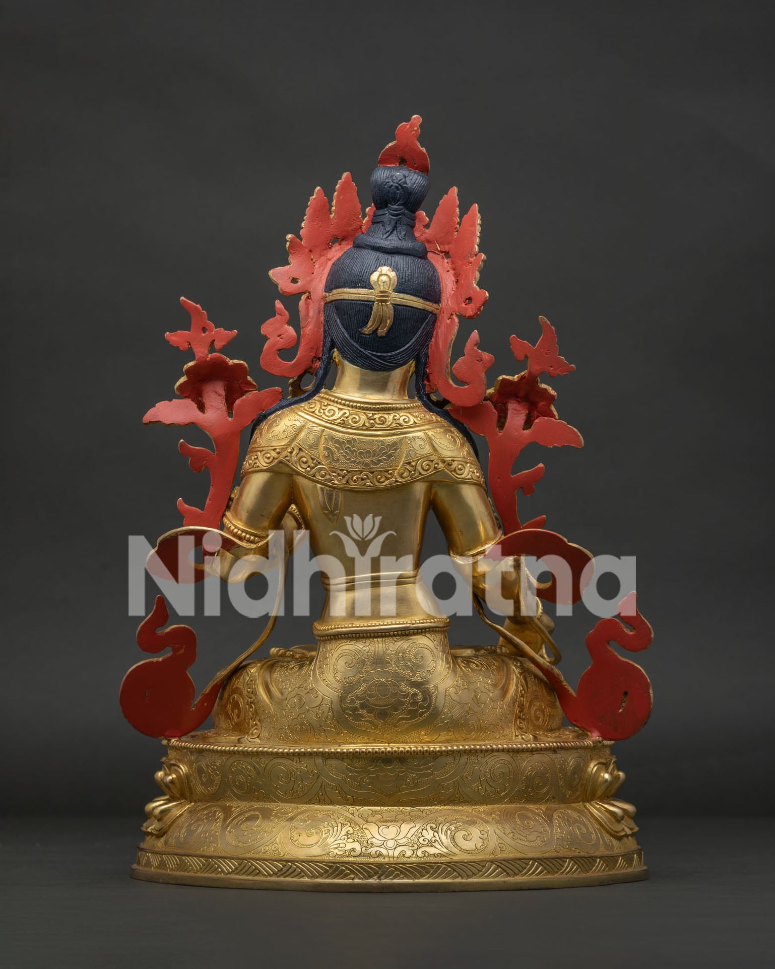 Back view of handmade White Tara Statue with detailed craftsmanship and lotus base