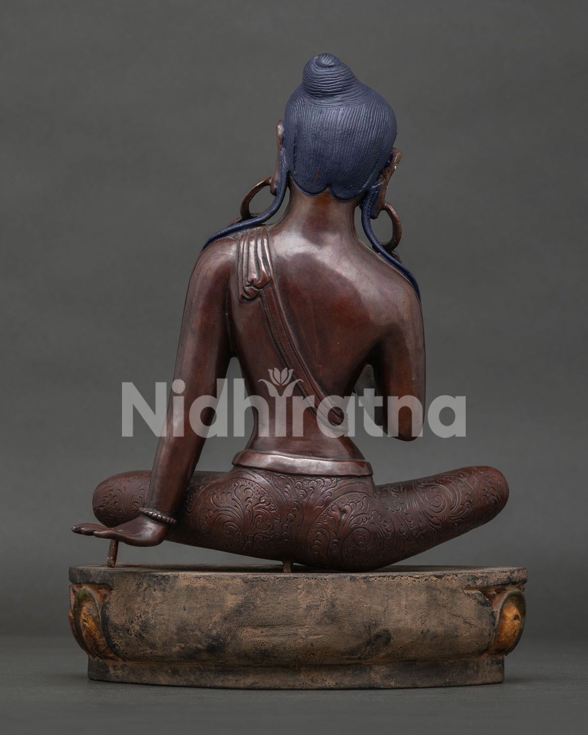 Back view of Jetsun Dolma Green Tara copper statue with flowing hair and lotus base, made in Nepal