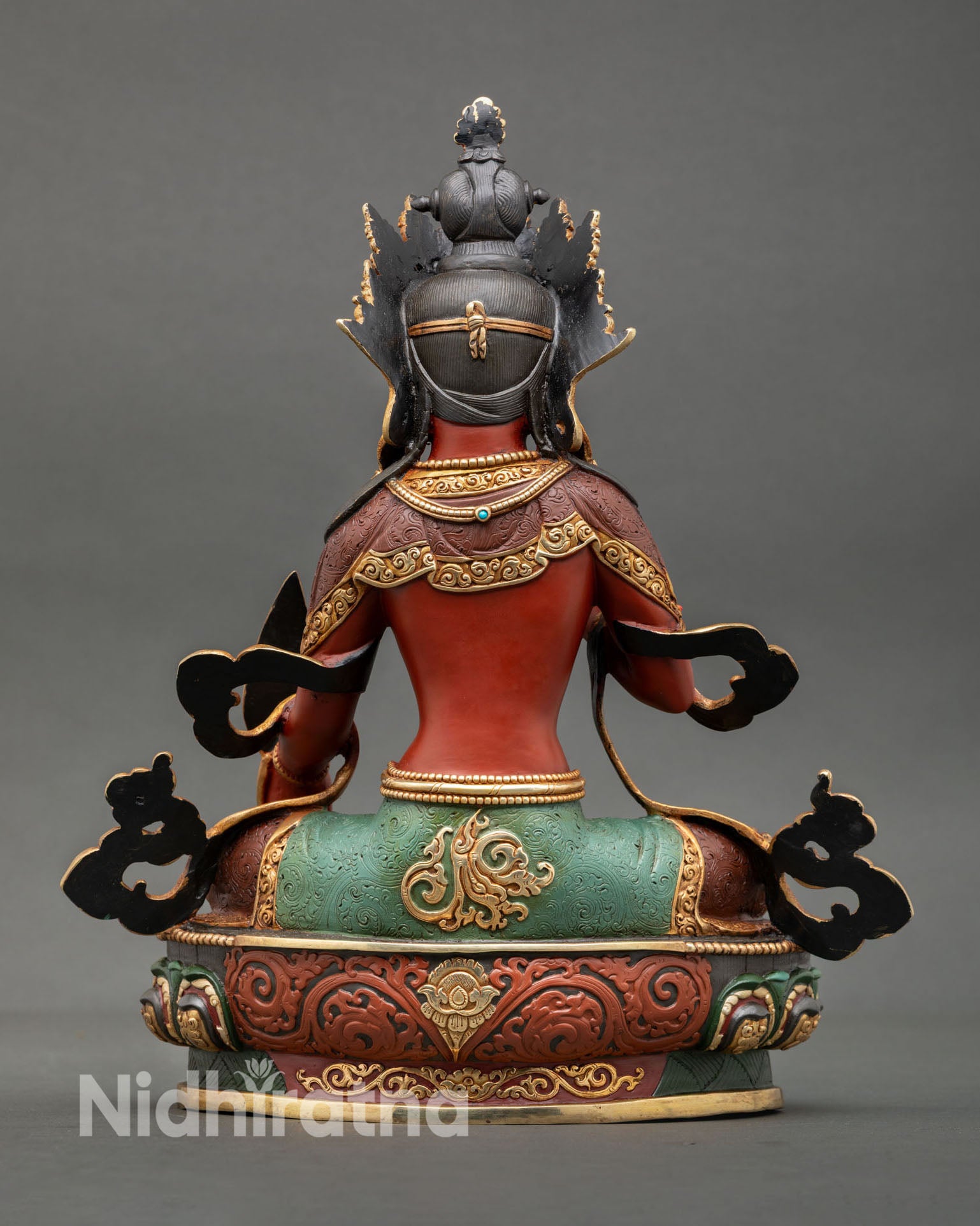 Back view of Ksitigarbha statue handcrafted Buddhist sculpture from Nepal, detailed copper metalwork with gold gilding finish, Newari artisan craftsmanship
