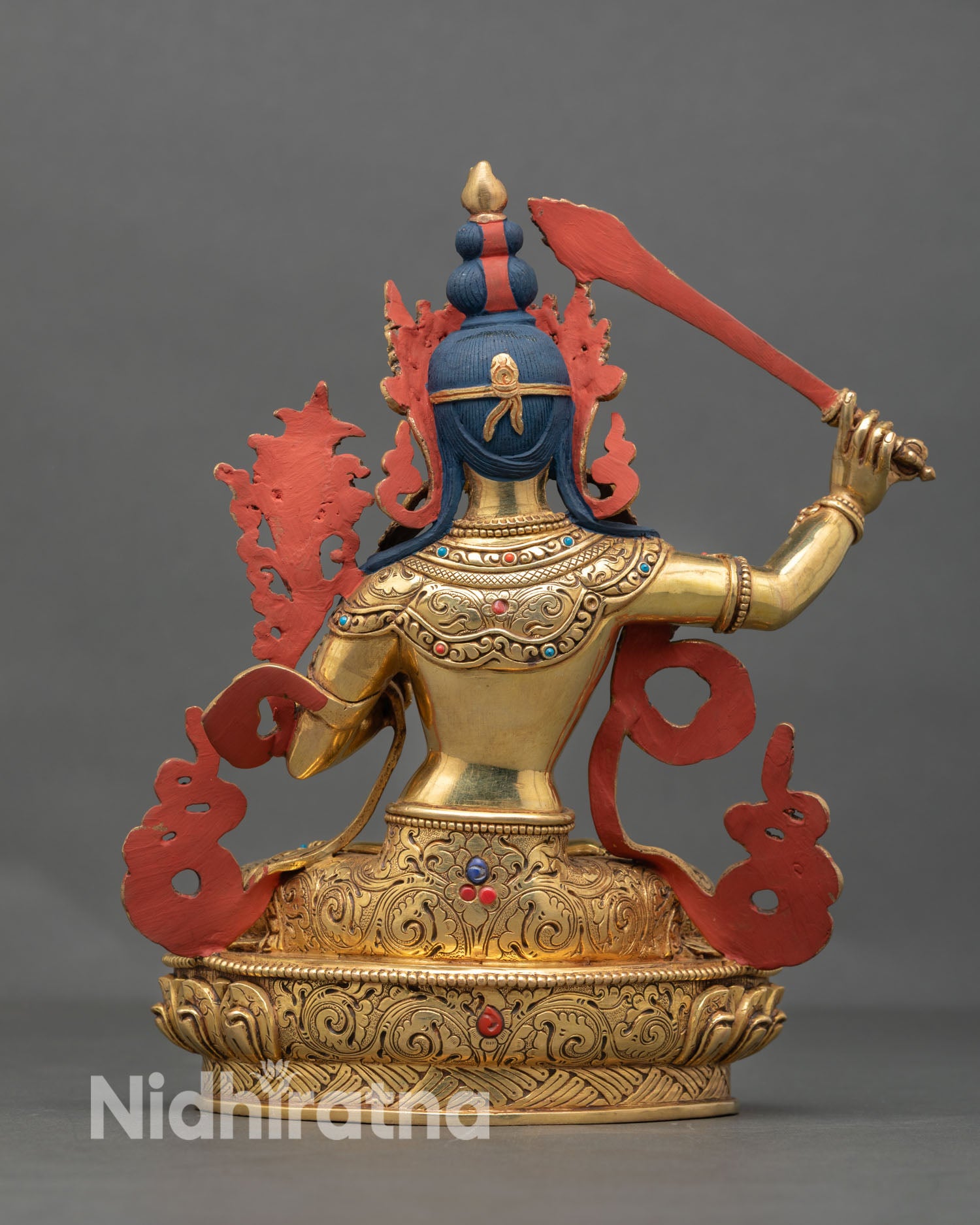 Back view of Manjushree statue highlighting intricate carvings and traditional Nepalese craftsmanship