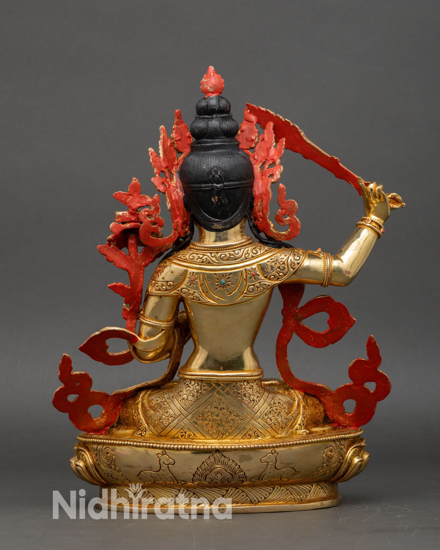 Back view of Manjushri statue semi-precious stones ornate lotus pedestal Himalayan craftsmanship