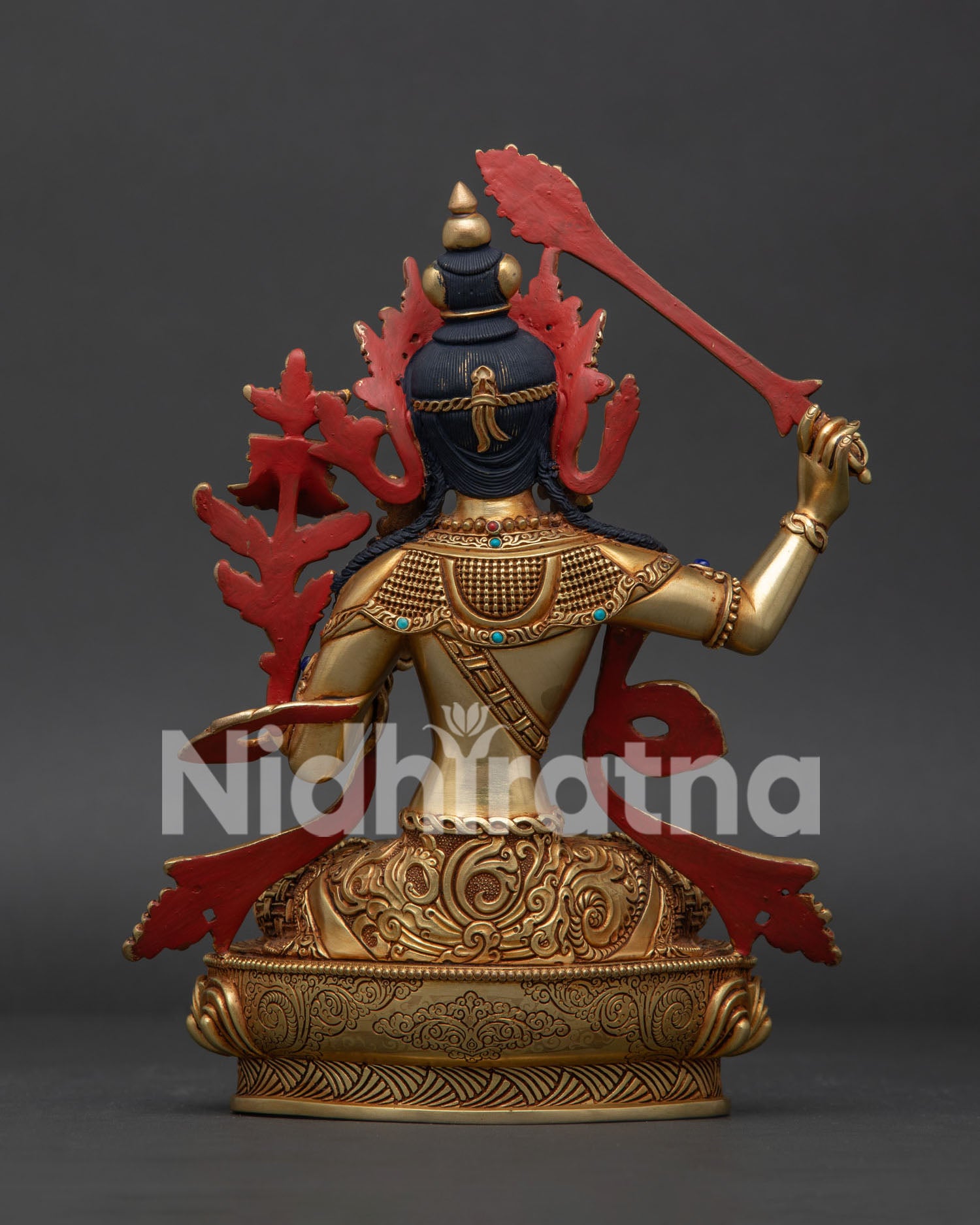 Back view of Manjushri statue showing handcrafted copper work and Himalayan detailing