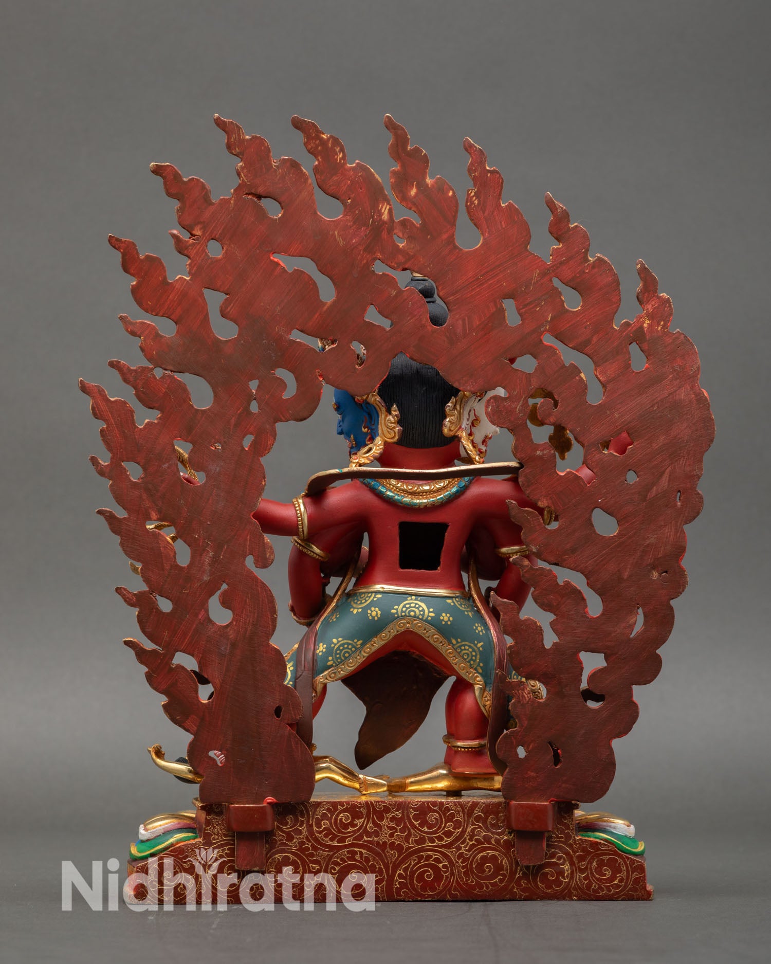 Back view of Marpo Red Dzambhala statue handcrafted copper gold gilded Himalayan artisan sculpture