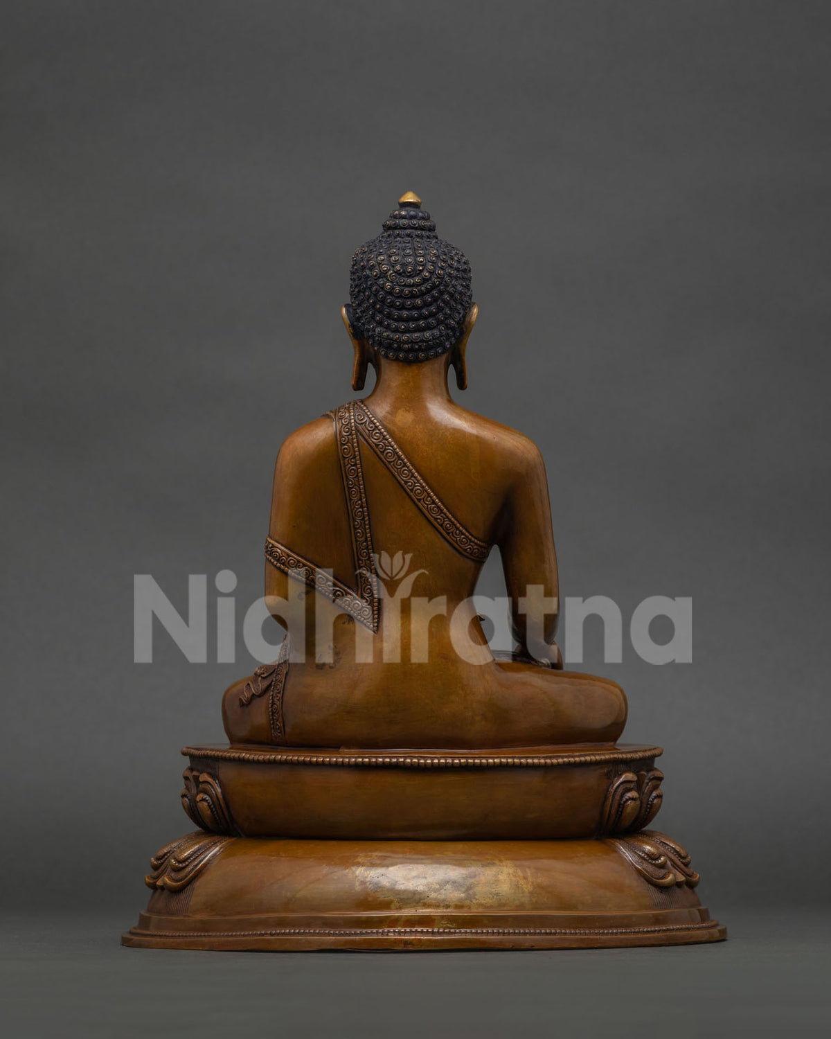back view of oxidized copper shakyamuni buddha statue showing craftsmanship