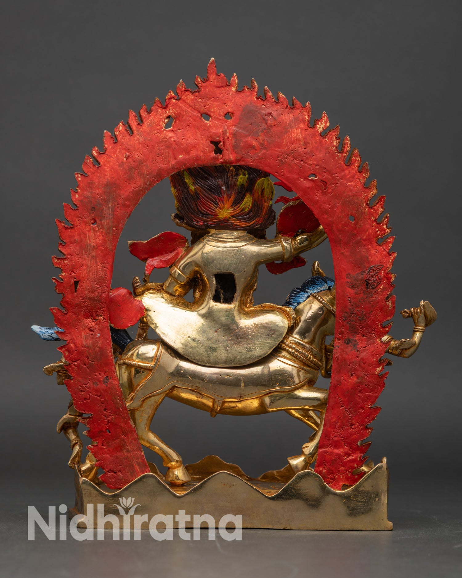 Back view of Palden Lhamo statue blazing halo of flames handcrafted copper gold finished Tibetan Buddhist protector deity