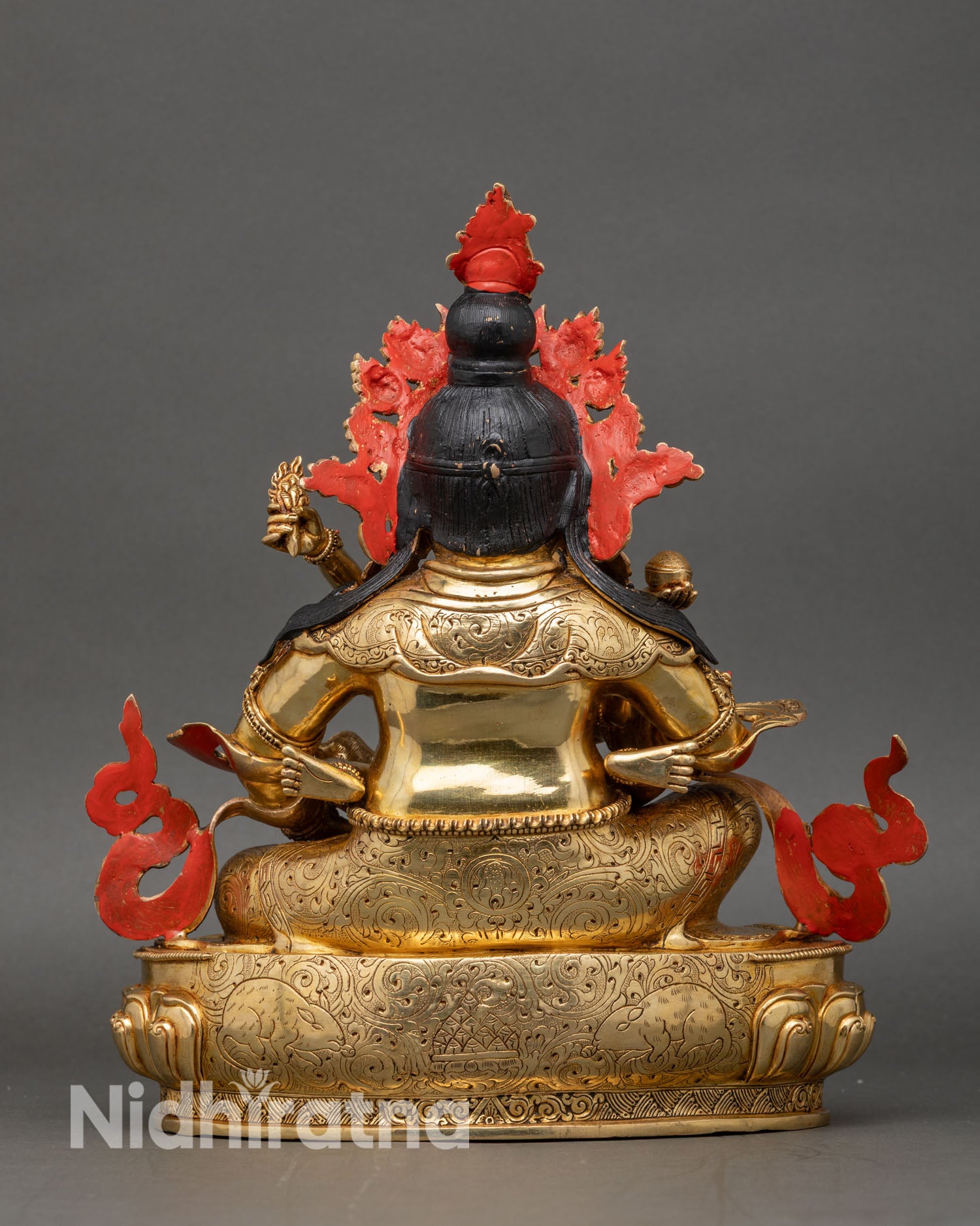 Back view of Red Dzambhala Yab Yum statue with consort on lotus pedestal showing craftsmanship and intricate details