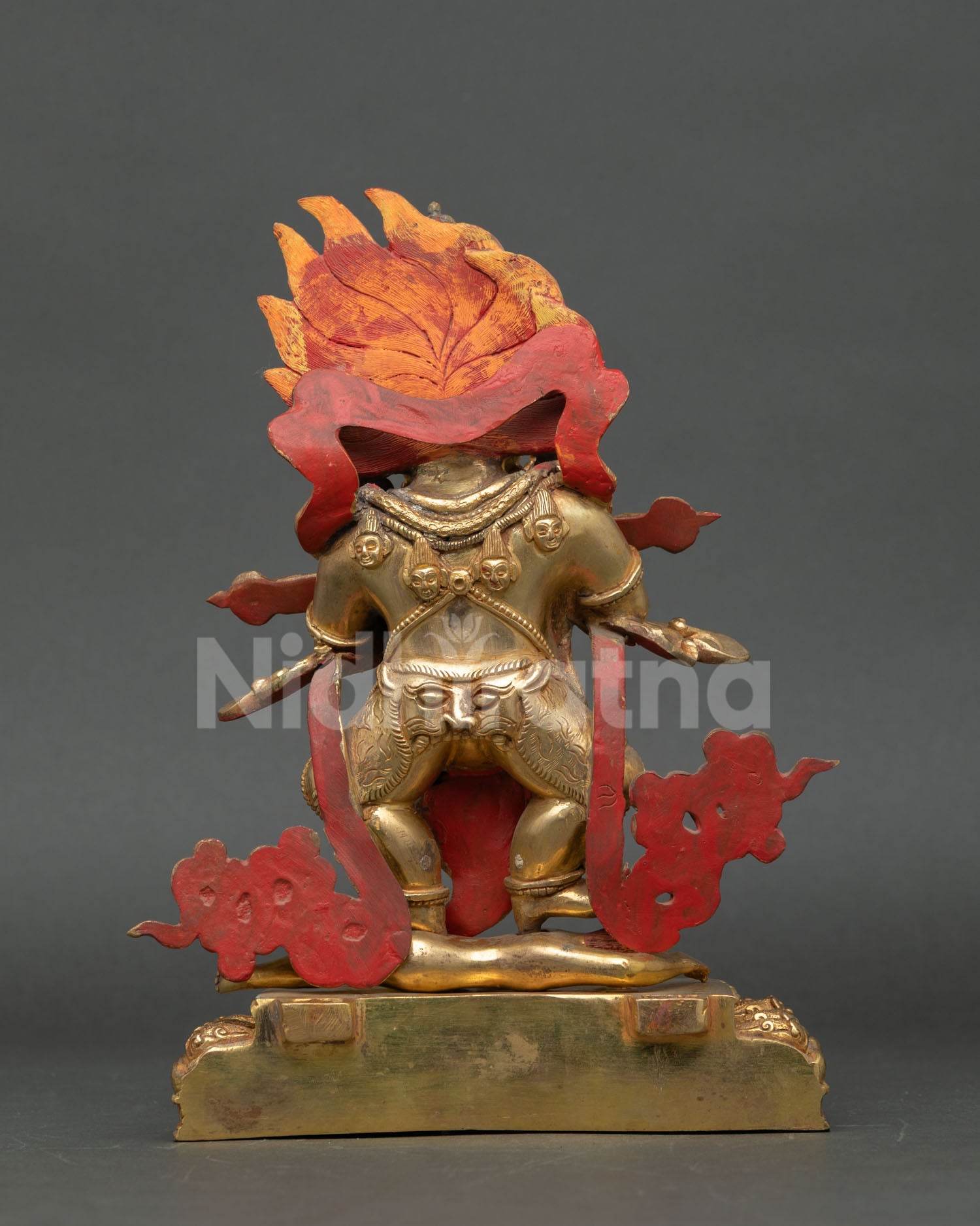 Back view of Sakya Mahakala Buddhist statue highlighting copper body gold gilding and traditional Nepalese artistry