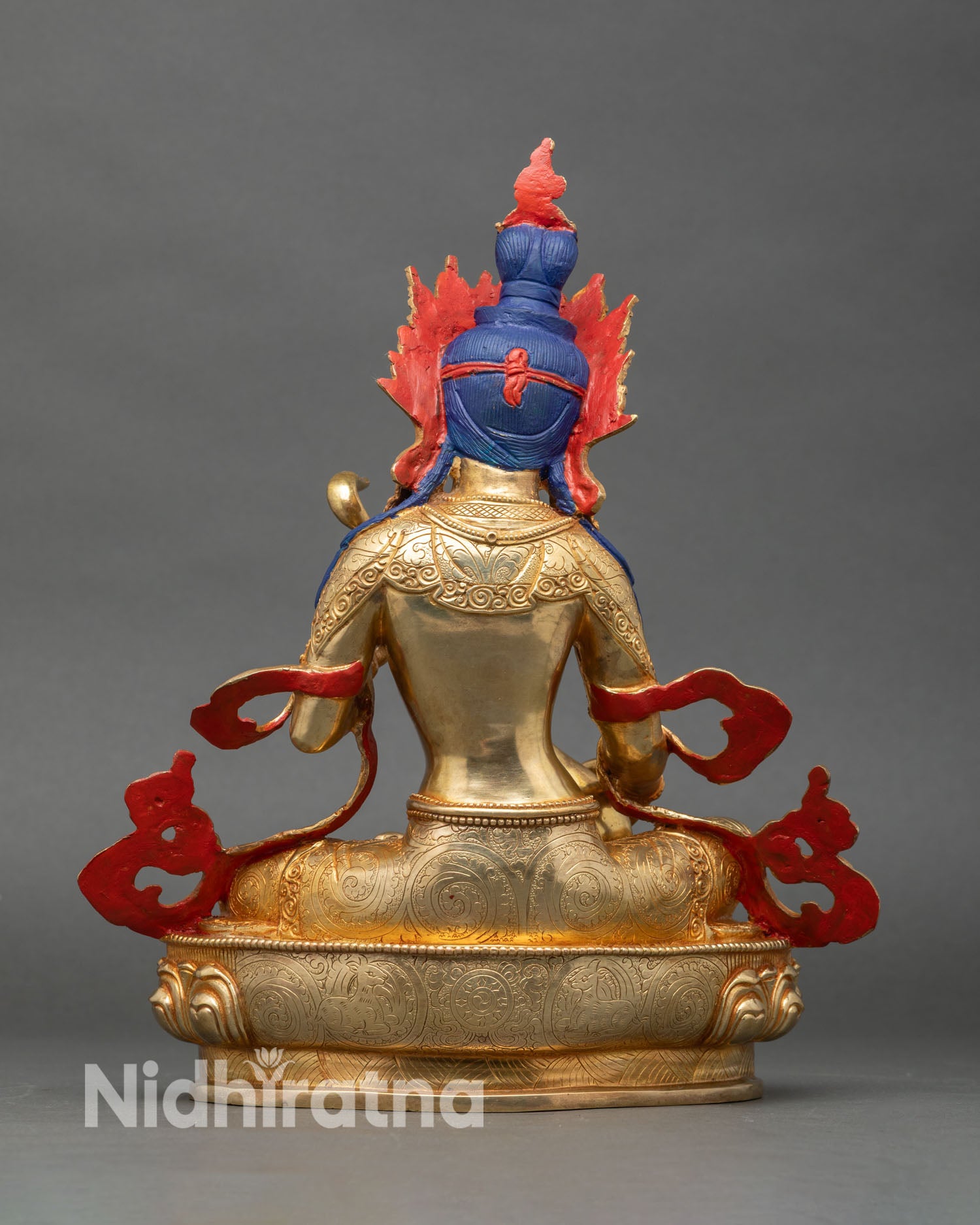 Back view of Saraswati statue showing detailed carving and sacred craftsmanship