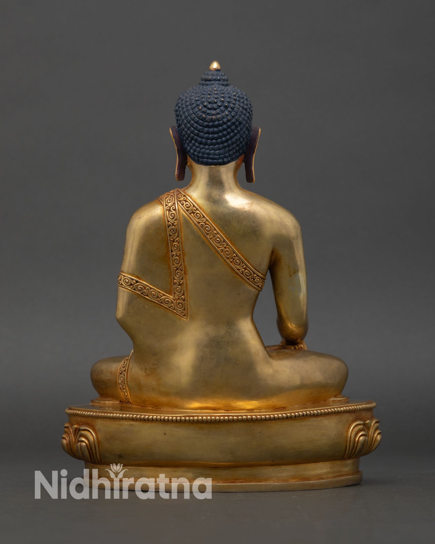 Back view of Shakyamuni Buddha statue handcrafted copper gold Himalayan Nepalese artistry