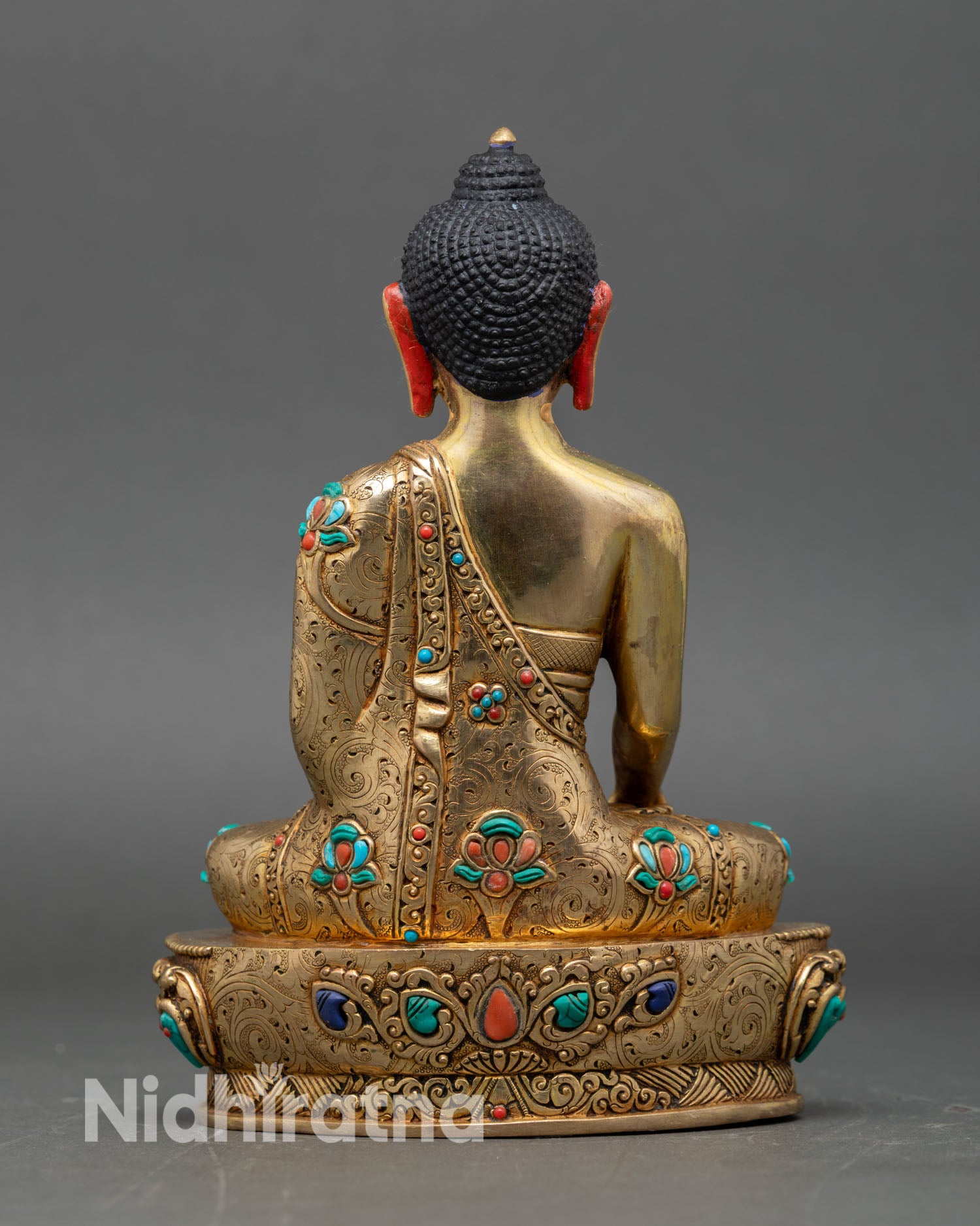 Back view of Shakyamuni Buddha statue lotus pedestal inlaid turquoise coral Himalayan artistry