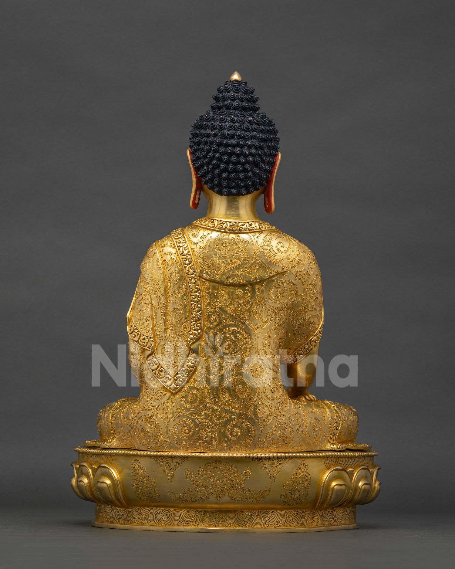 Back view of Shakyamuni Buddha statue Sri Lanka showing lotus seat and copper finish