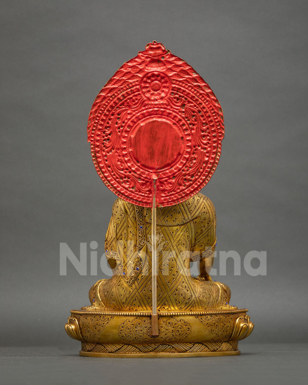 Back view of Shakyamuni Buddha statue with hand-engraved robe and lotus base, handmade in Nepal