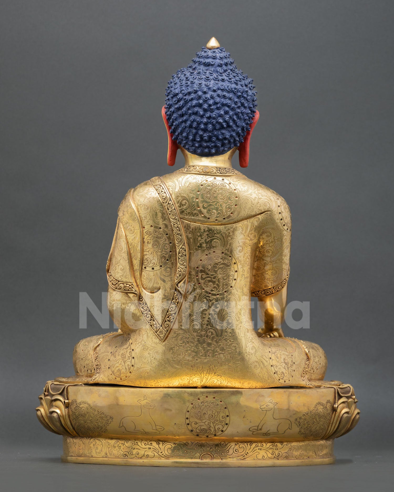 back view of shakyamuni buddha statue with engraved robe and copper alloy craftsmanship
