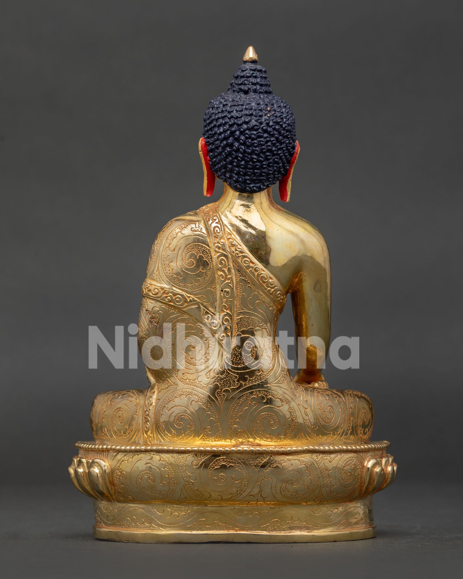 Back view of Shakyamuni Buddha Statue with intricate monastic robe carving and Himalayan craftsmanship