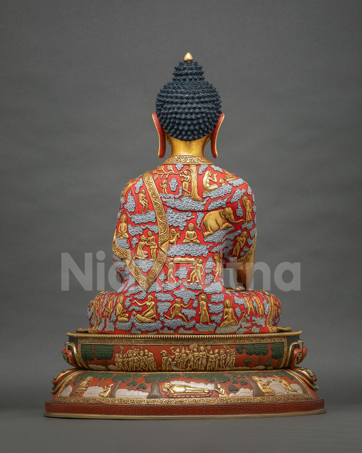 Back view of Shakyamuni Buddha statue with sculpted life story robe and carved lotus base panels