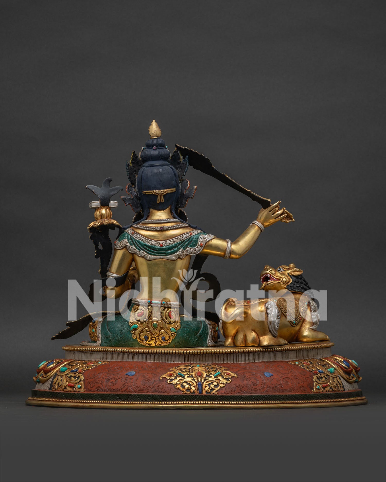 Back view of Simhanada Manjushri statue with silver-plated snow lion