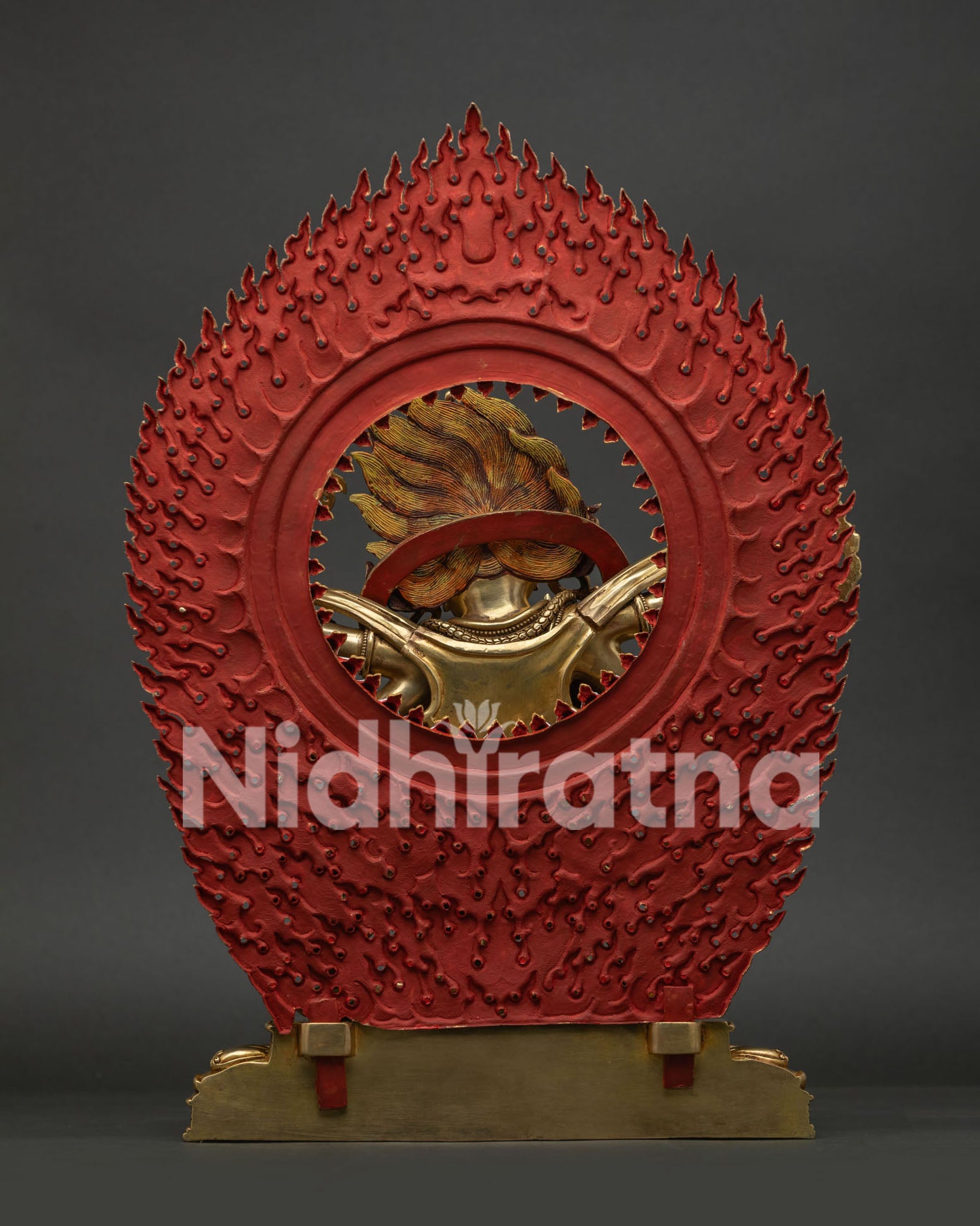 back view of six armed mahakala statue showing intricate halo carvings