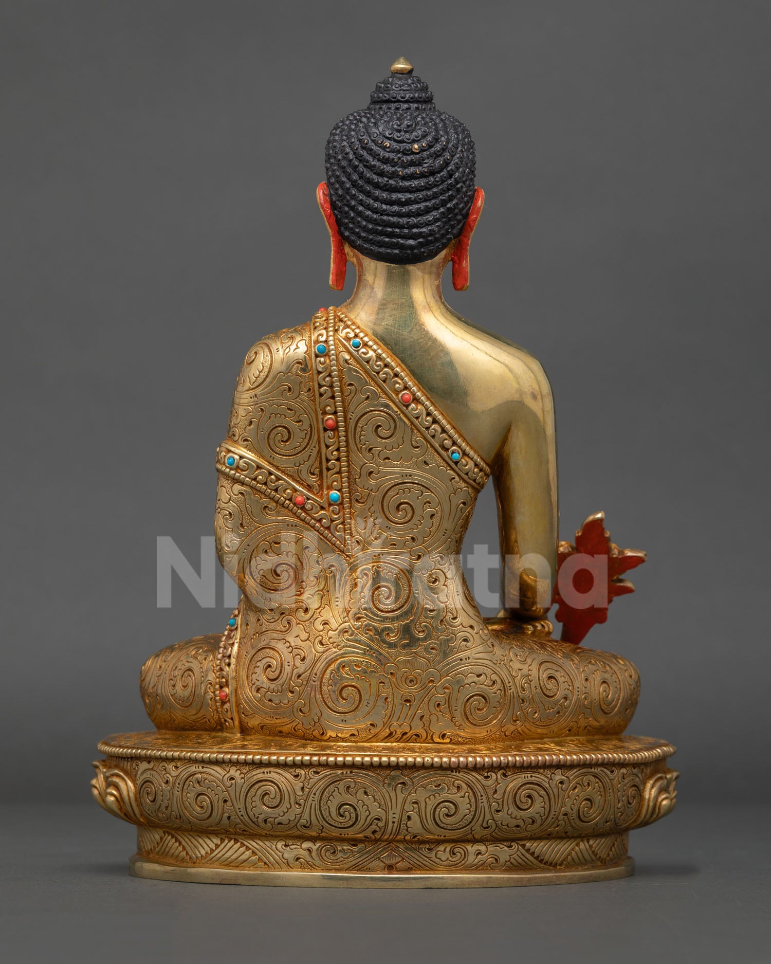 Back view of the copper lost-wax cast Medicine Buddha statue showing heritage Nepalese artwork