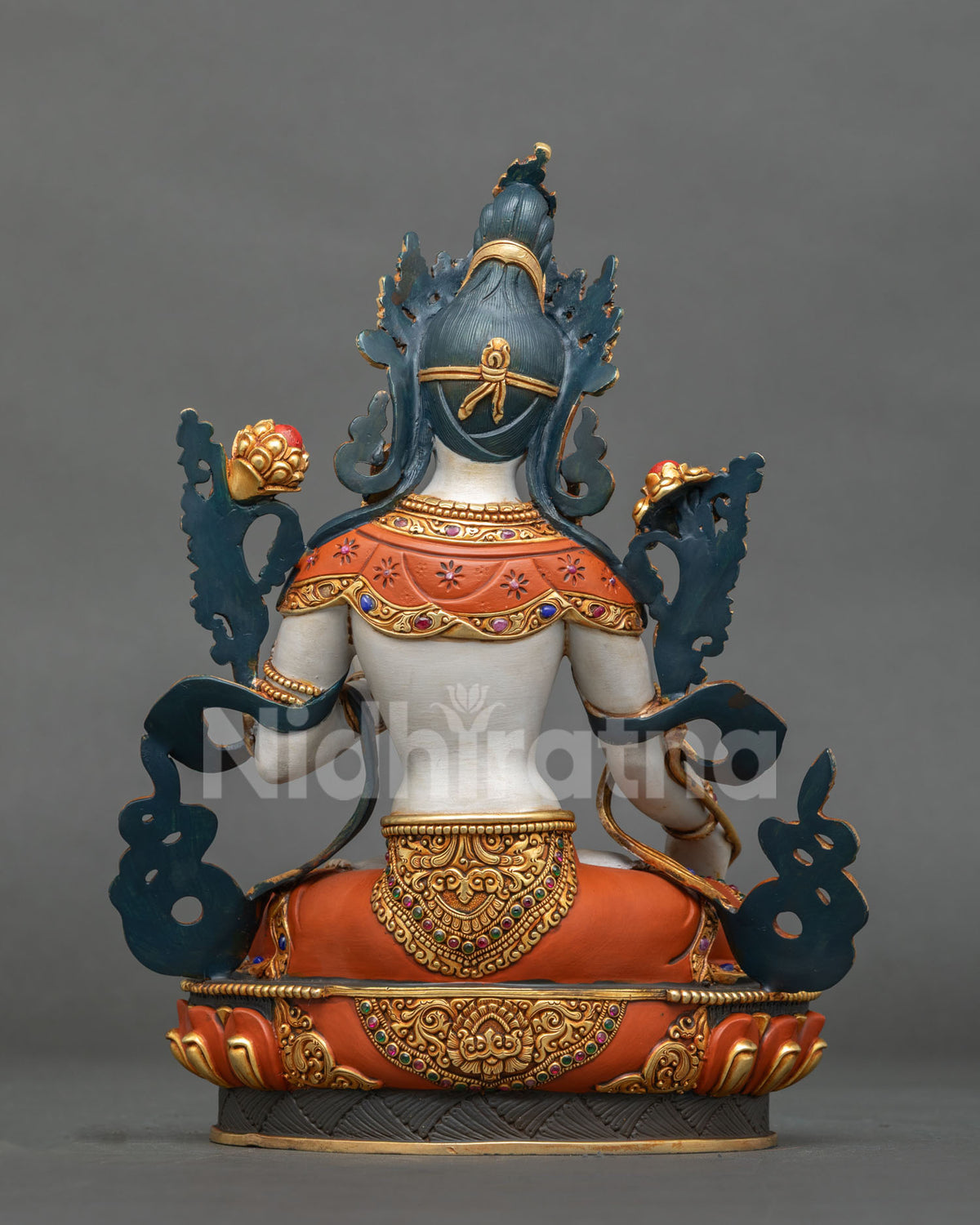back view of tibetan buddhist white tara statue with gold gilded scrollwork and lotus base