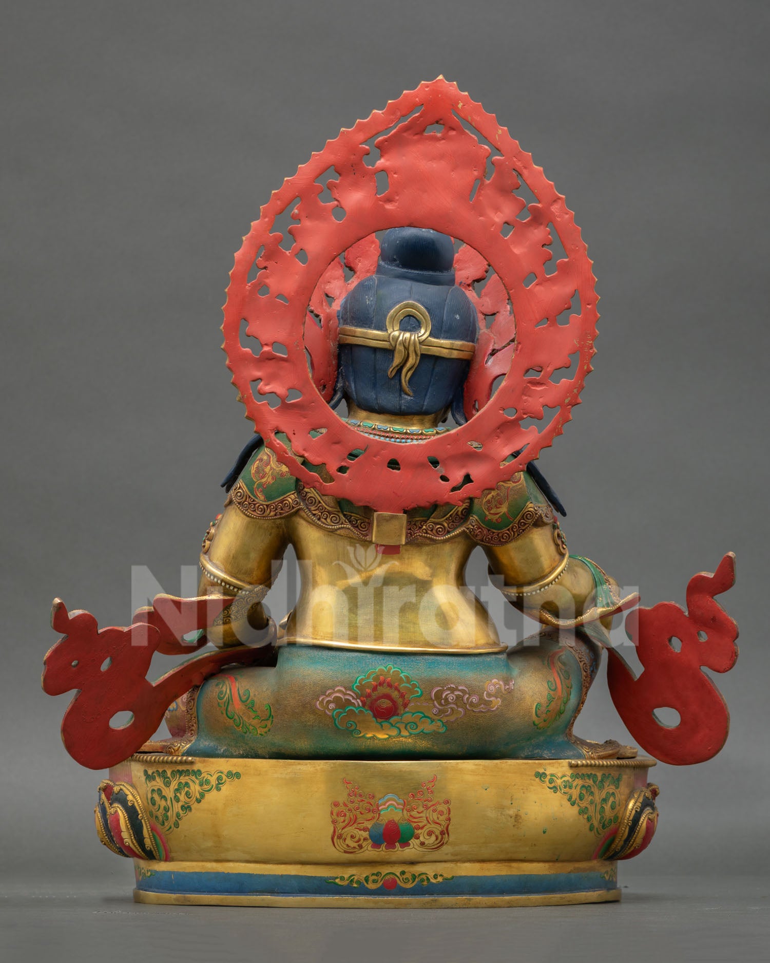 Back view of Tibetan Dzambhala statue with antique-style gold gilded detailing