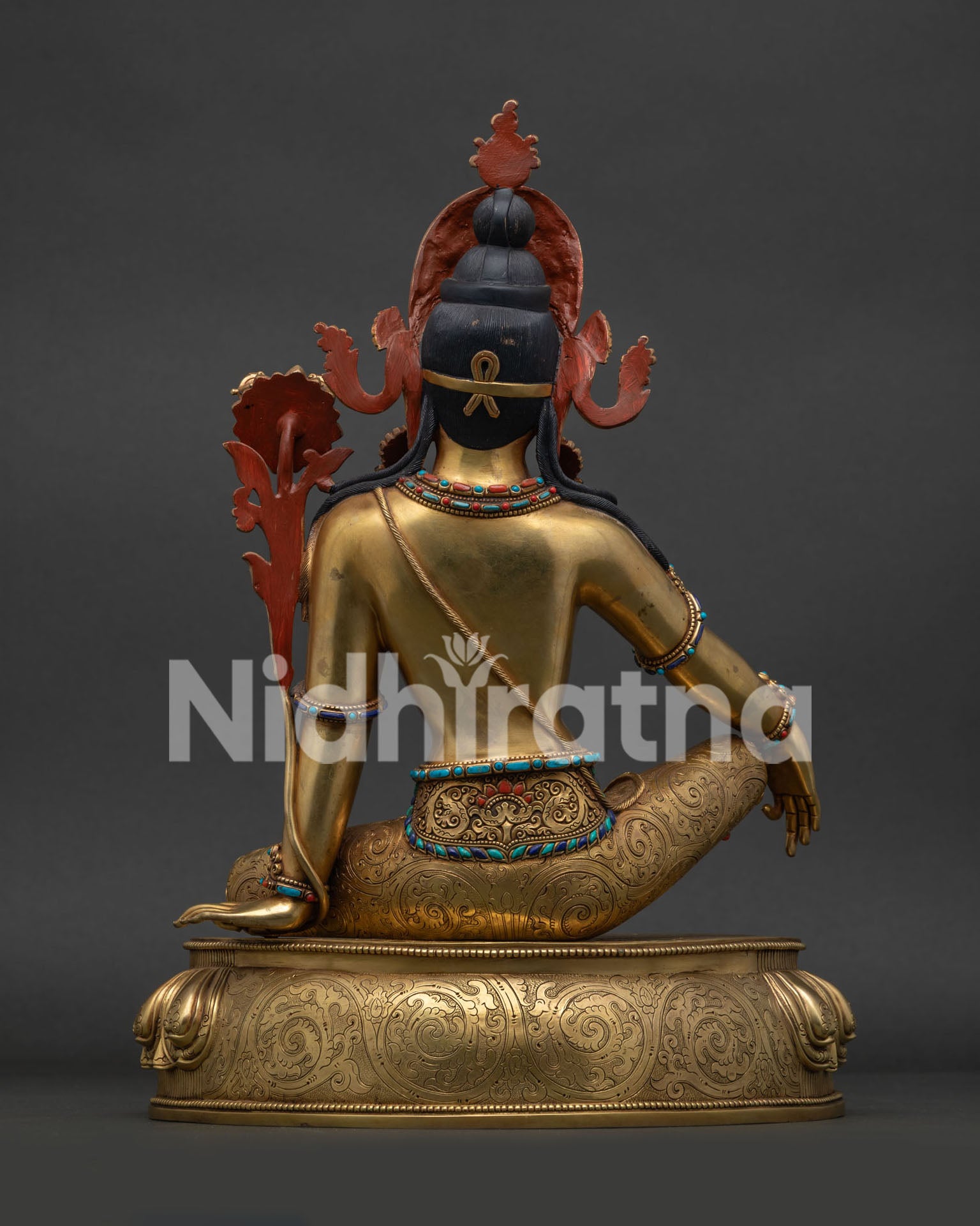 Back view of traditional Nepalese Indra statue displaying lost-wax copper craft