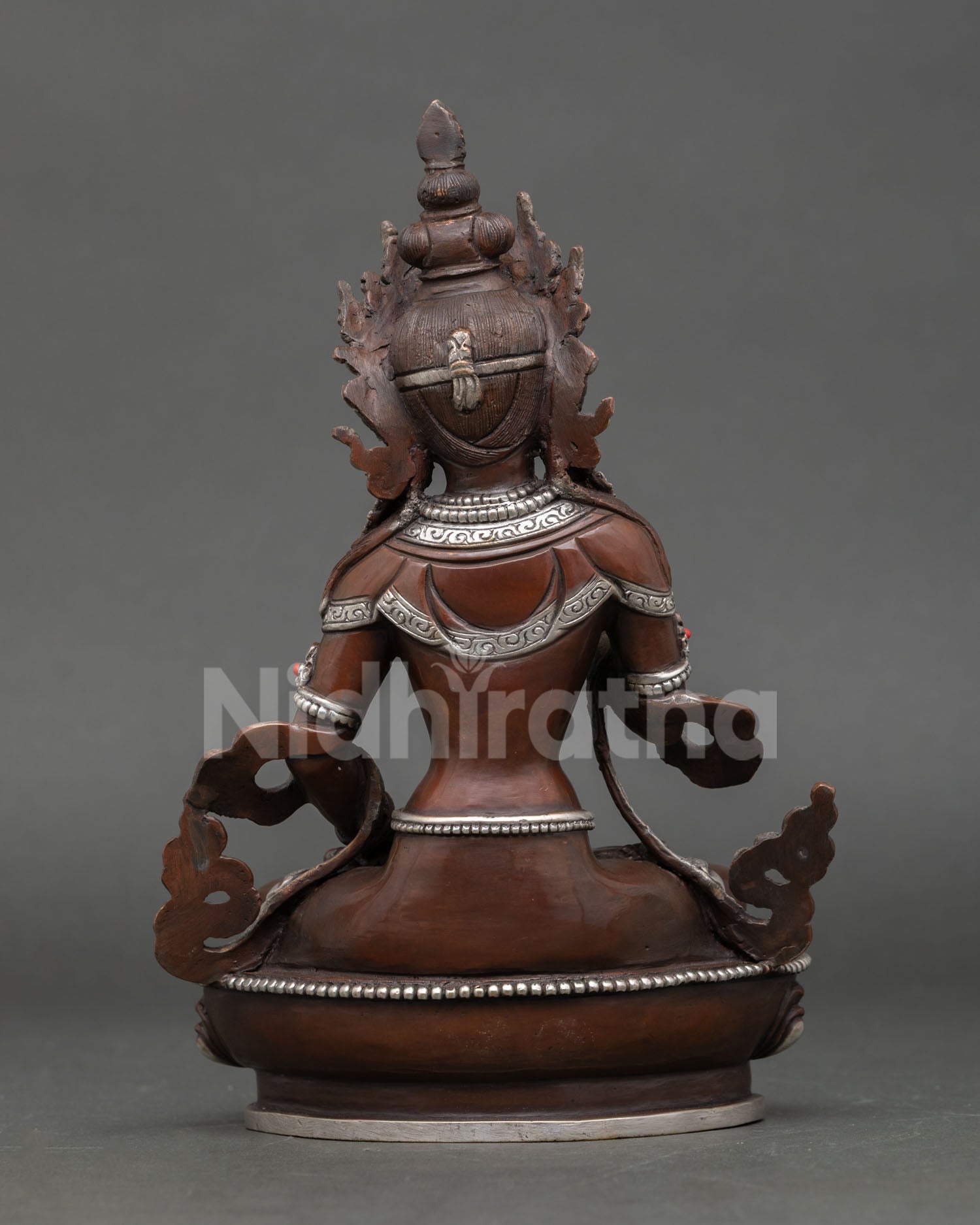 Back view of Vajrasattva Buddhist statue, Nepalese artisan metalwork