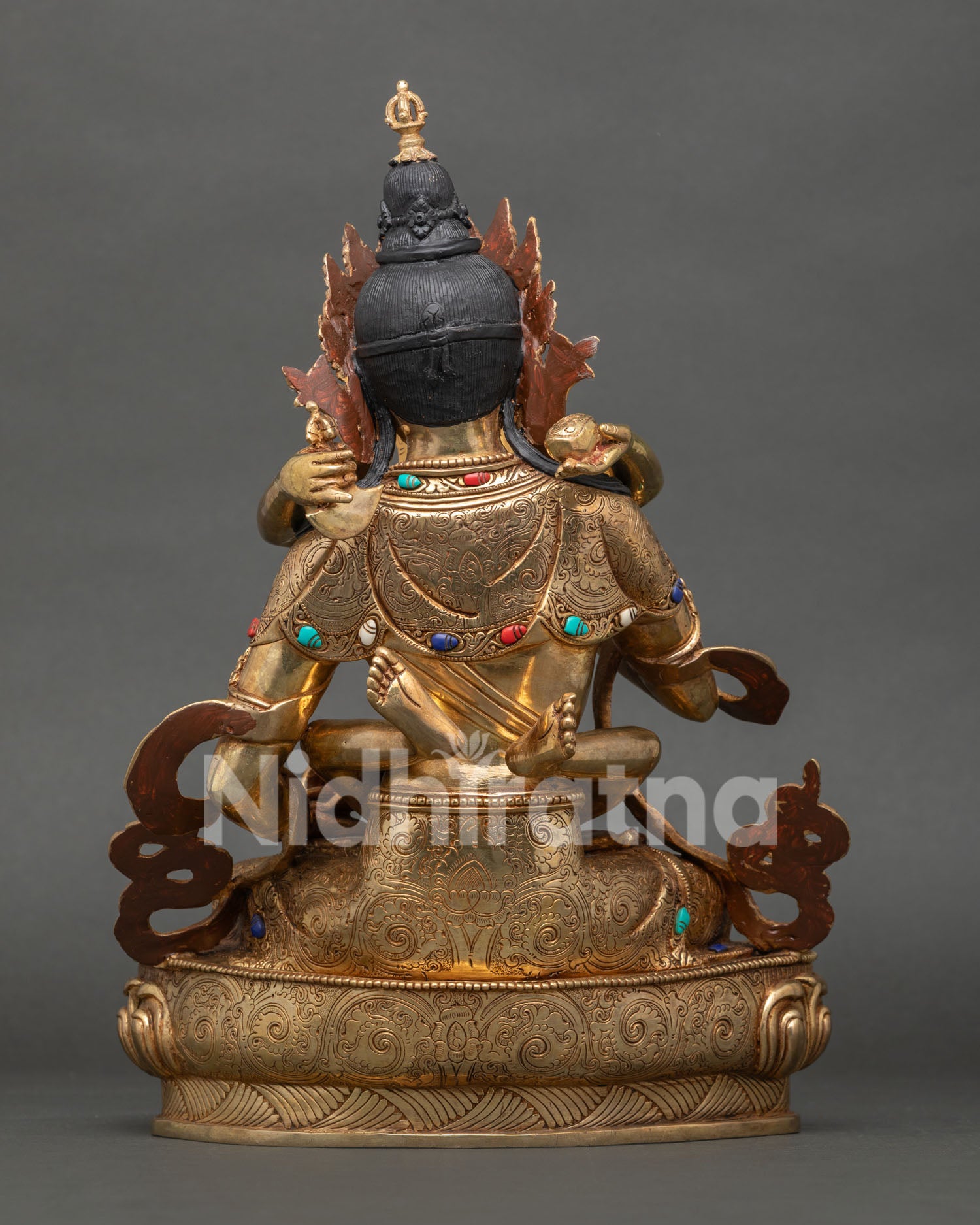 back view of vajrasattva yab-yum statue with engraved lotus base and traditional nepalese artistry
