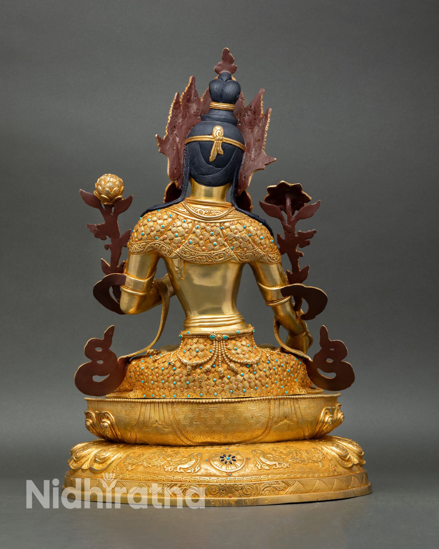 Back view of White Tara statue Nepalese handmade spiritual sculpture for meditation altar healing practice and devotional Buddhist decor