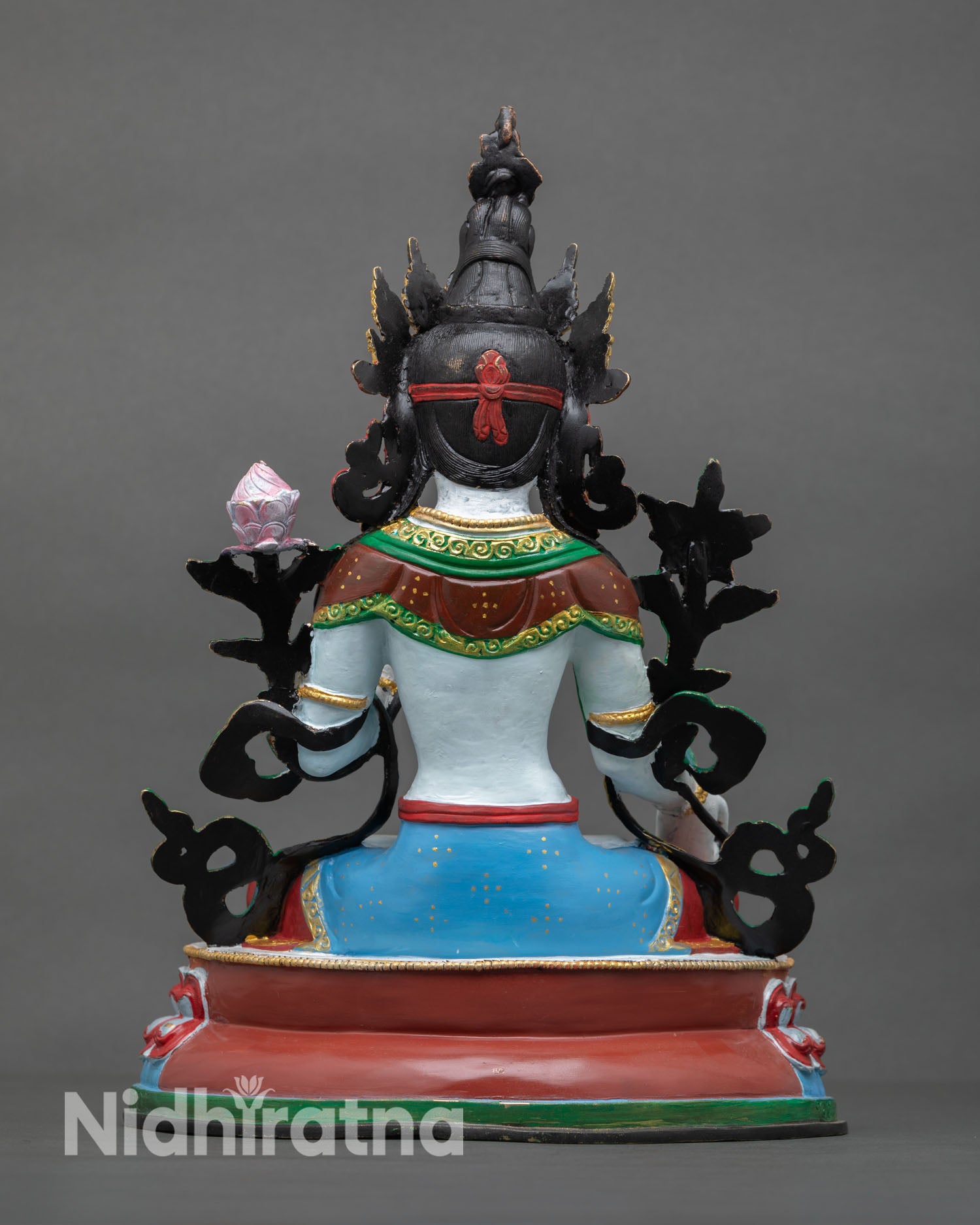 Back view of White Tara statue revealing detailed craftsmanship, crown ornaments, and traditional Himalayan sculptural artistry.