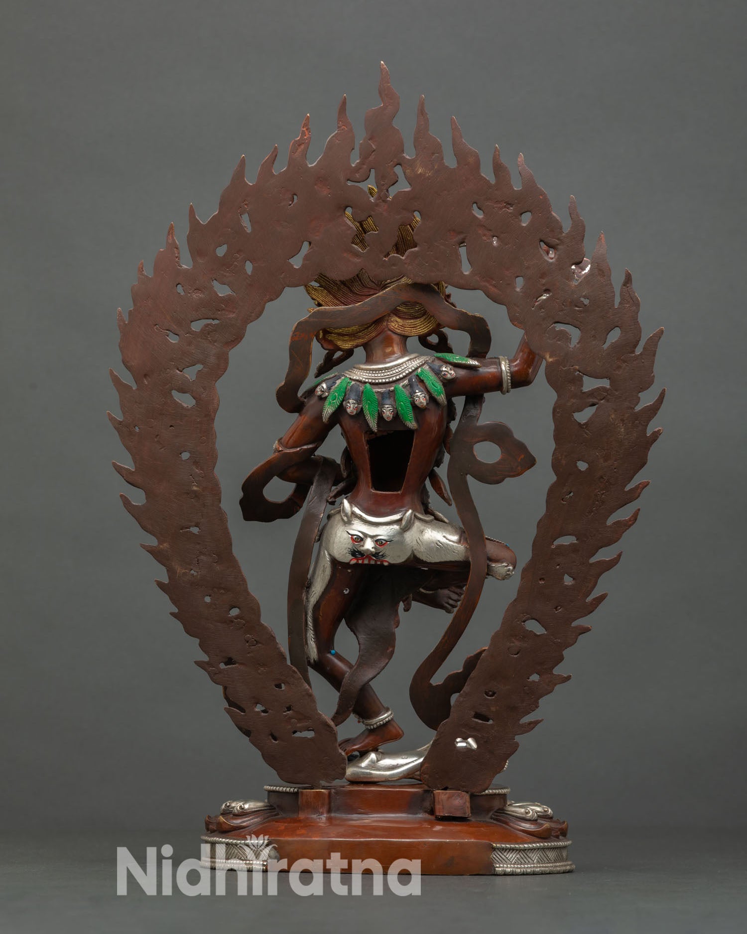 Back view vof Yeshe Walmo lotus pedestal flames copper silver plated Himalayan protector sculpture.