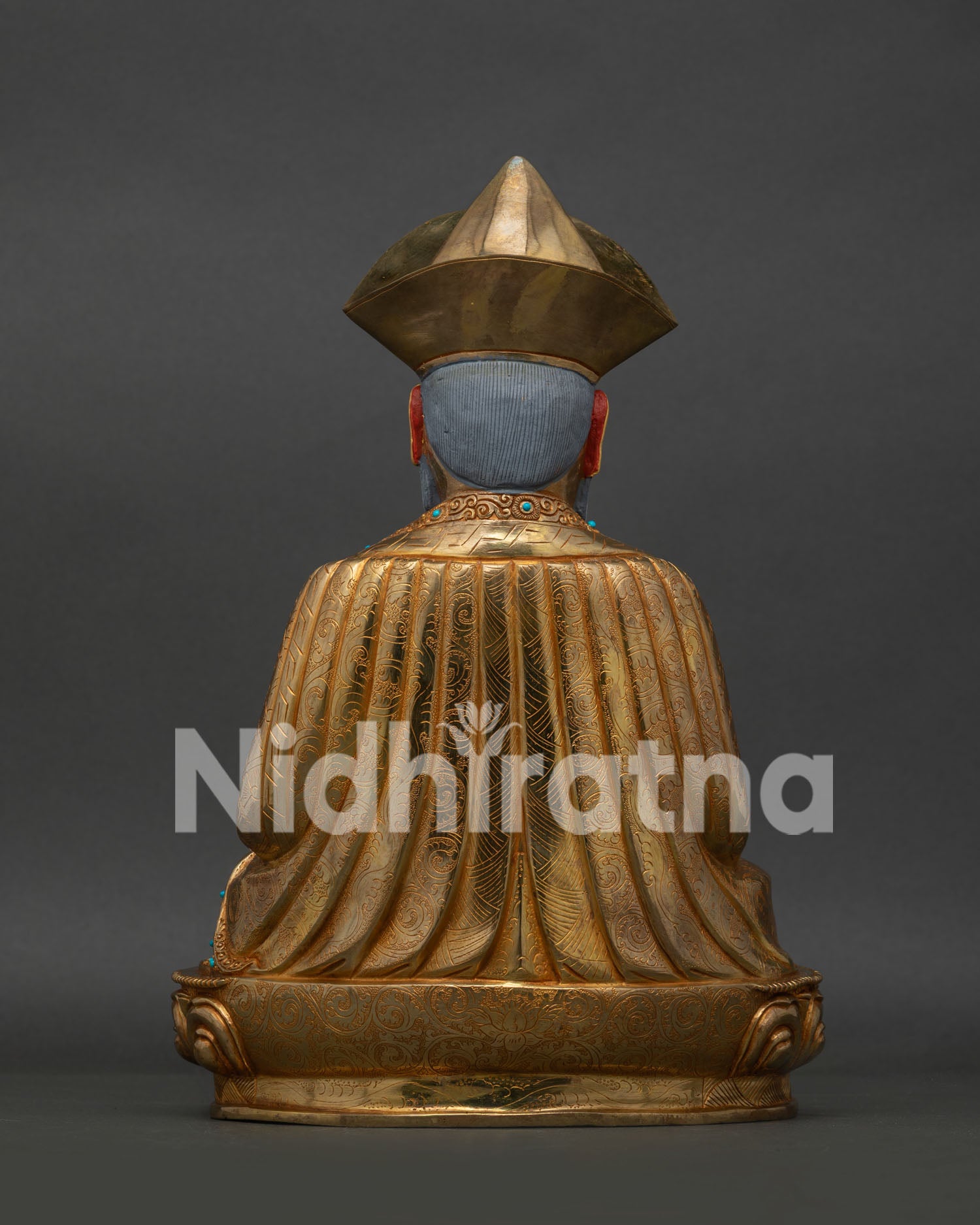 Back view of Zhabdrung Ngawang Namgyal Statue with engraved robe and lotus pedestal