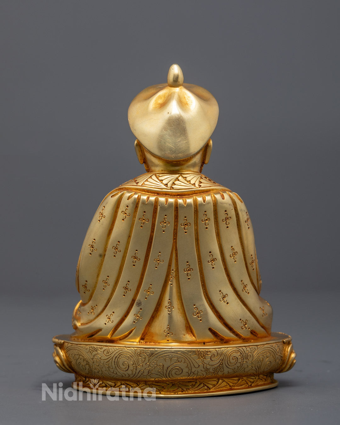 Back view of Zhabdrung statue with hollow base for mantra fillings and details