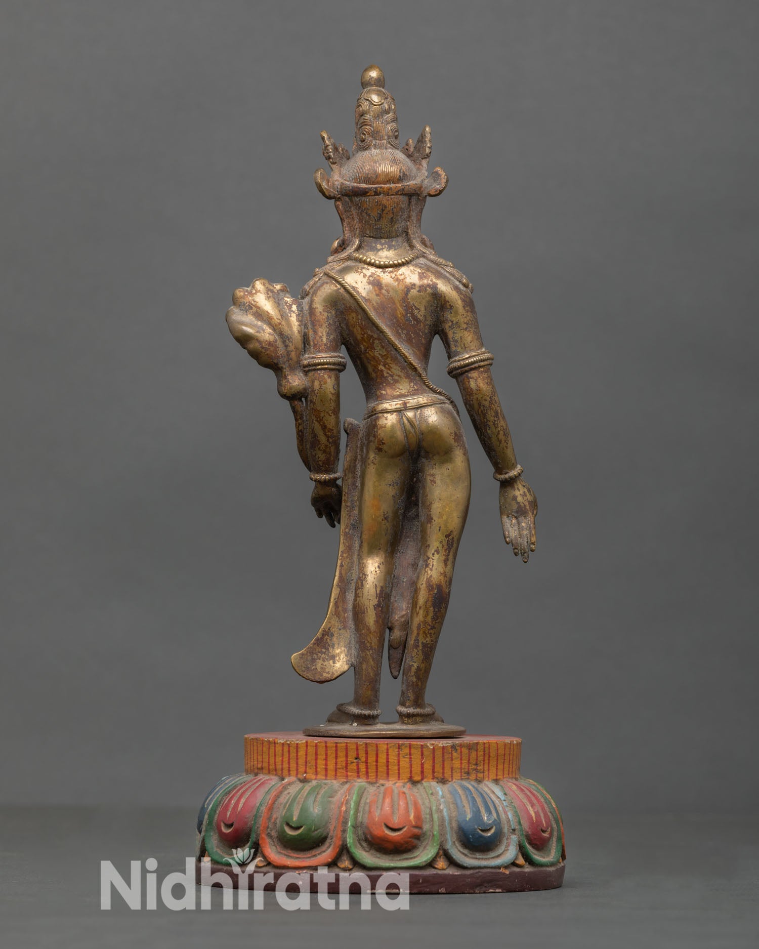 Back view of Padmapani Lokeshvara statue handcrafted Nepal copper sculpture lost wax ancient technique gold gilded finish sacred Buddhist altar decor