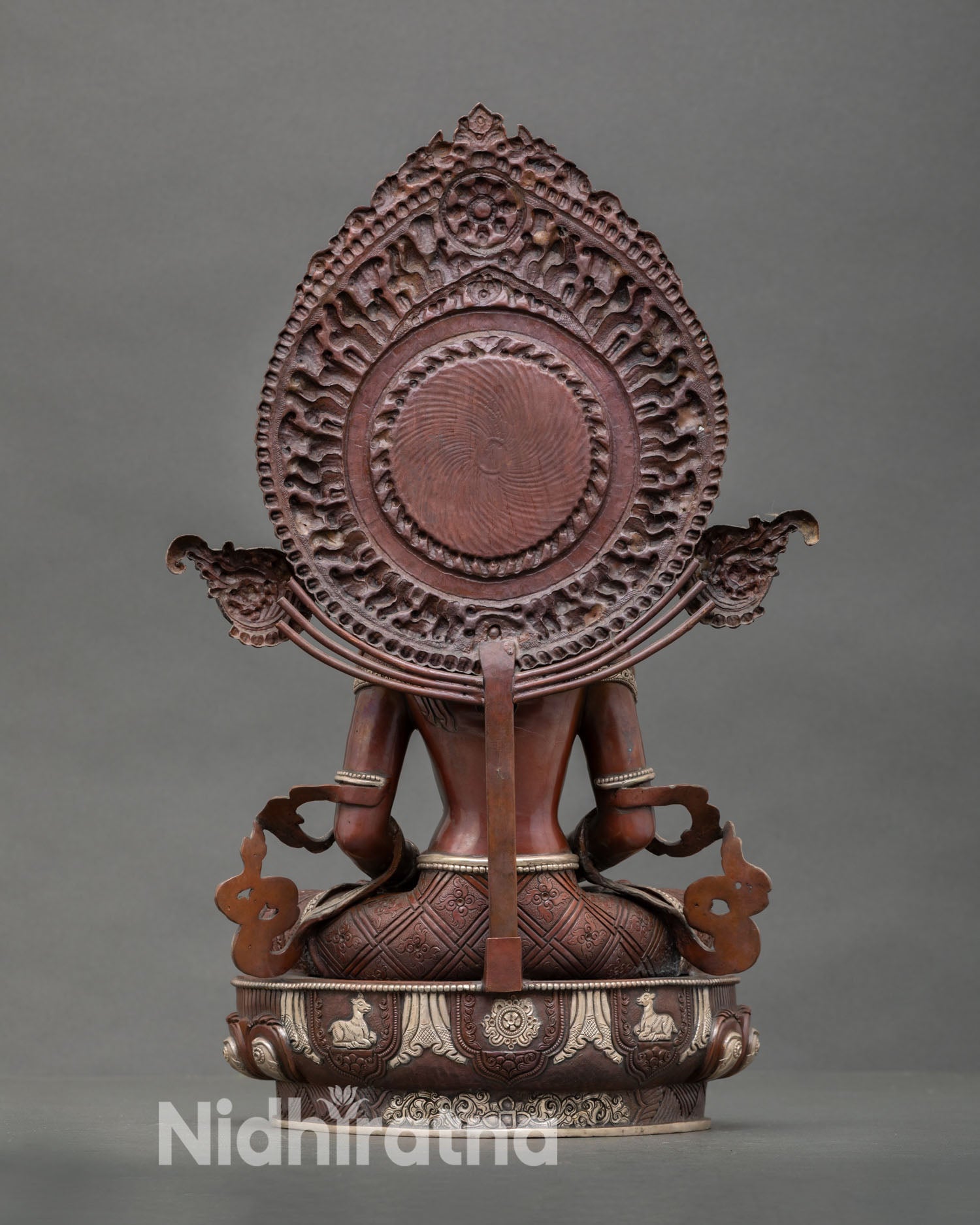 Back view of sacred Amitayus statue with detailed halo and traditional Himalayan craftsmanship