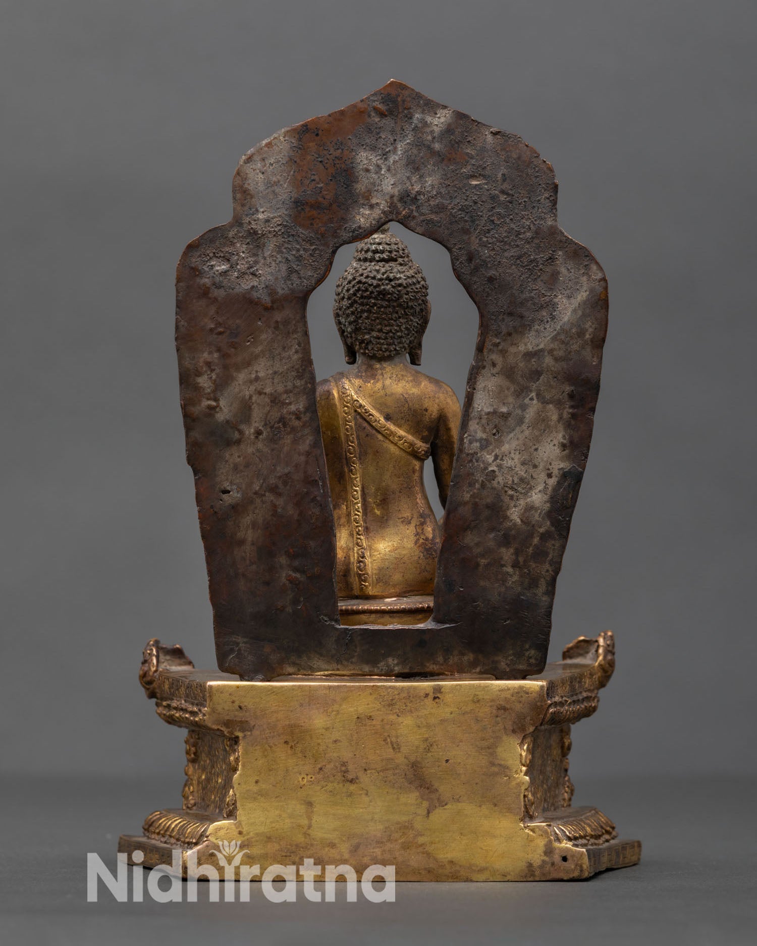 Back view Shakyamuni Buddha sculpture detailed craftsmanship copper artwork antique patina finish meditation altar sacred Buddhist decor