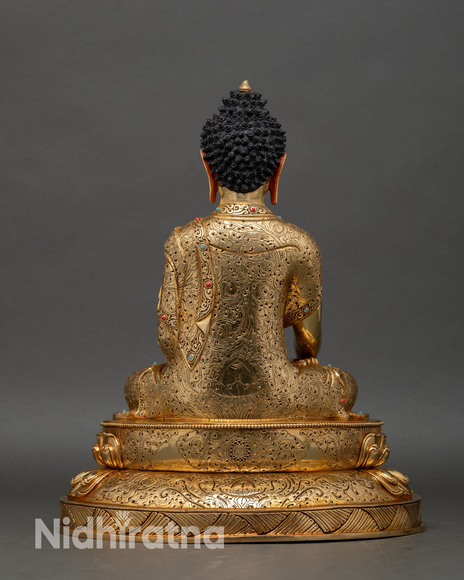 back view shakyamuni buddha statue detailed engraved base lotus pedestal copper alloy gold gilded nepal artisan work