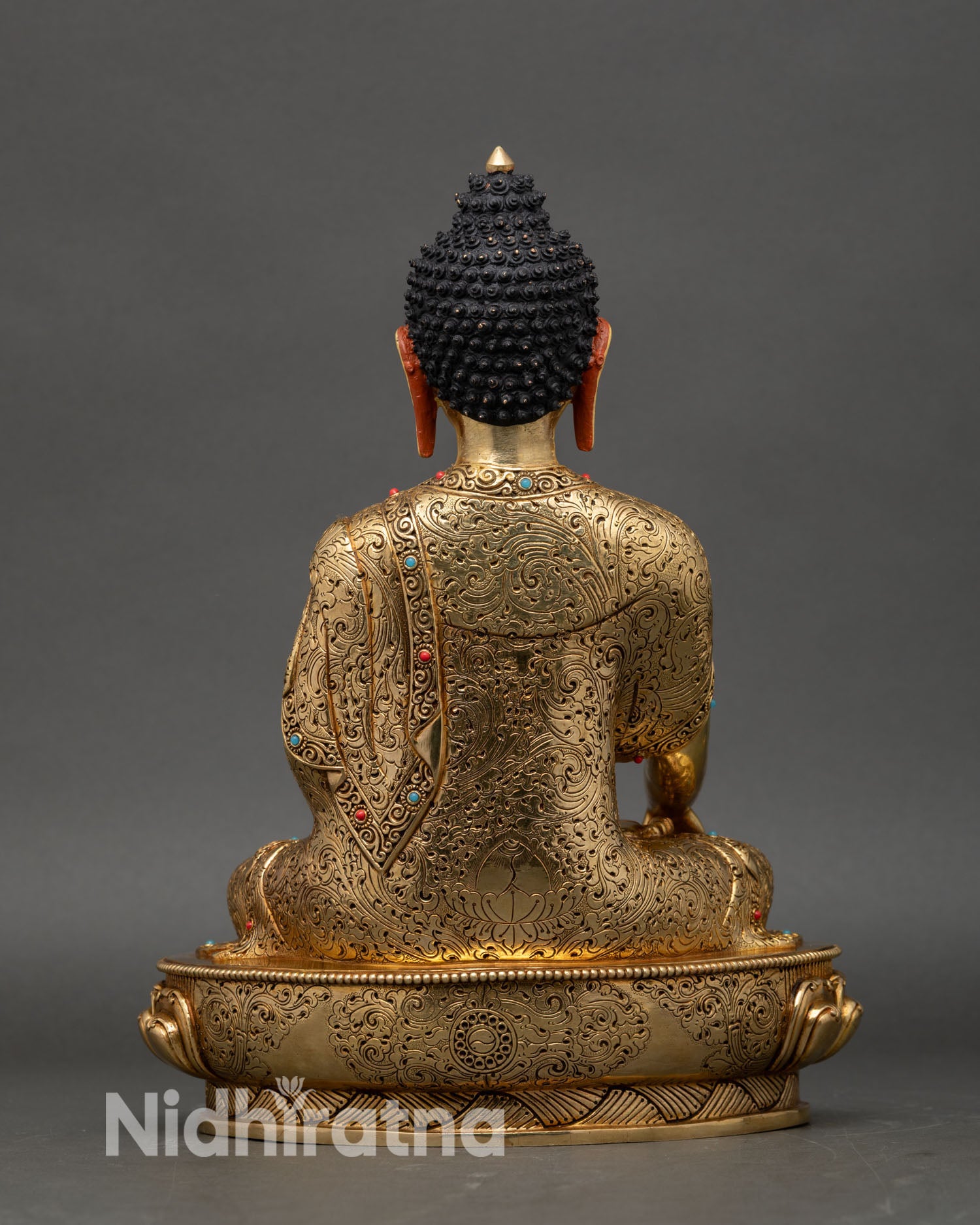 Back view Shakyamuni Buddha statue, detailed engraved robe and pedestal design