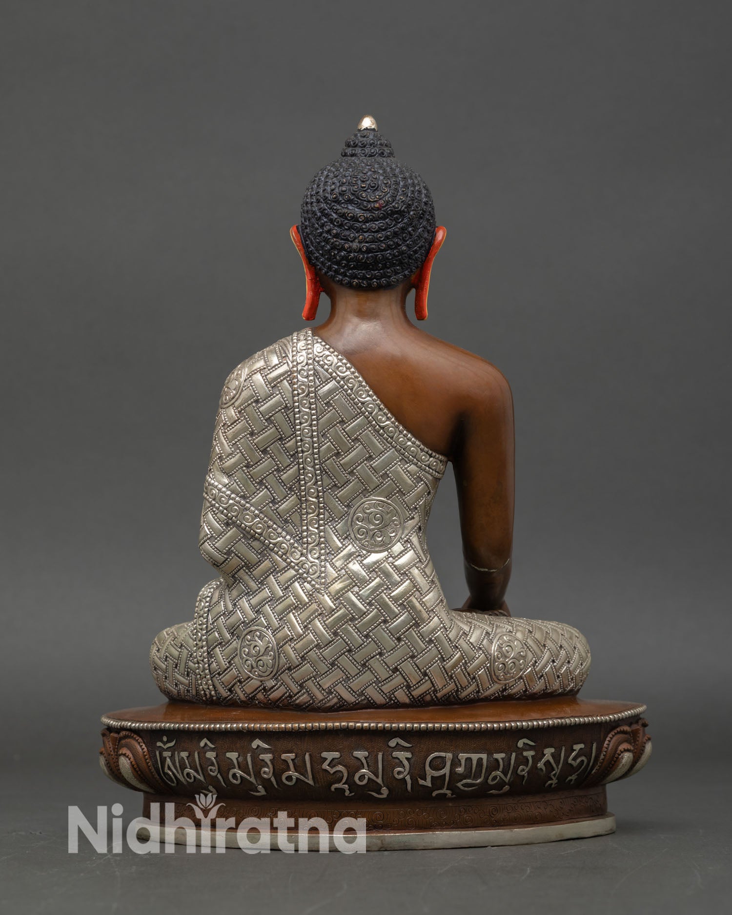 Back view of Shakyamuni Buddha statue detailed monastic robes lotus throne handcrafted
