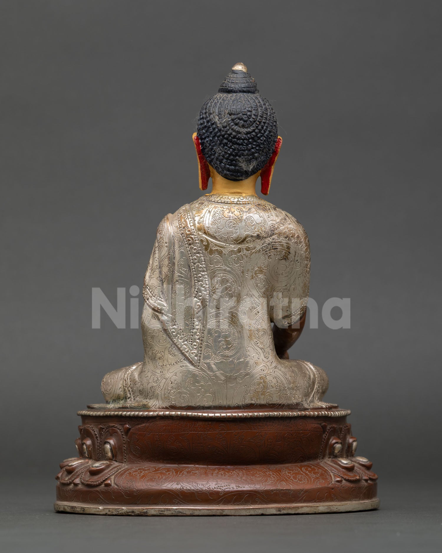 Back view of Shakyamuni Buddha statue handcrafted Nepal copper oxidized finish silver plated detailing traditional Newari artisan Buddhist sculpture